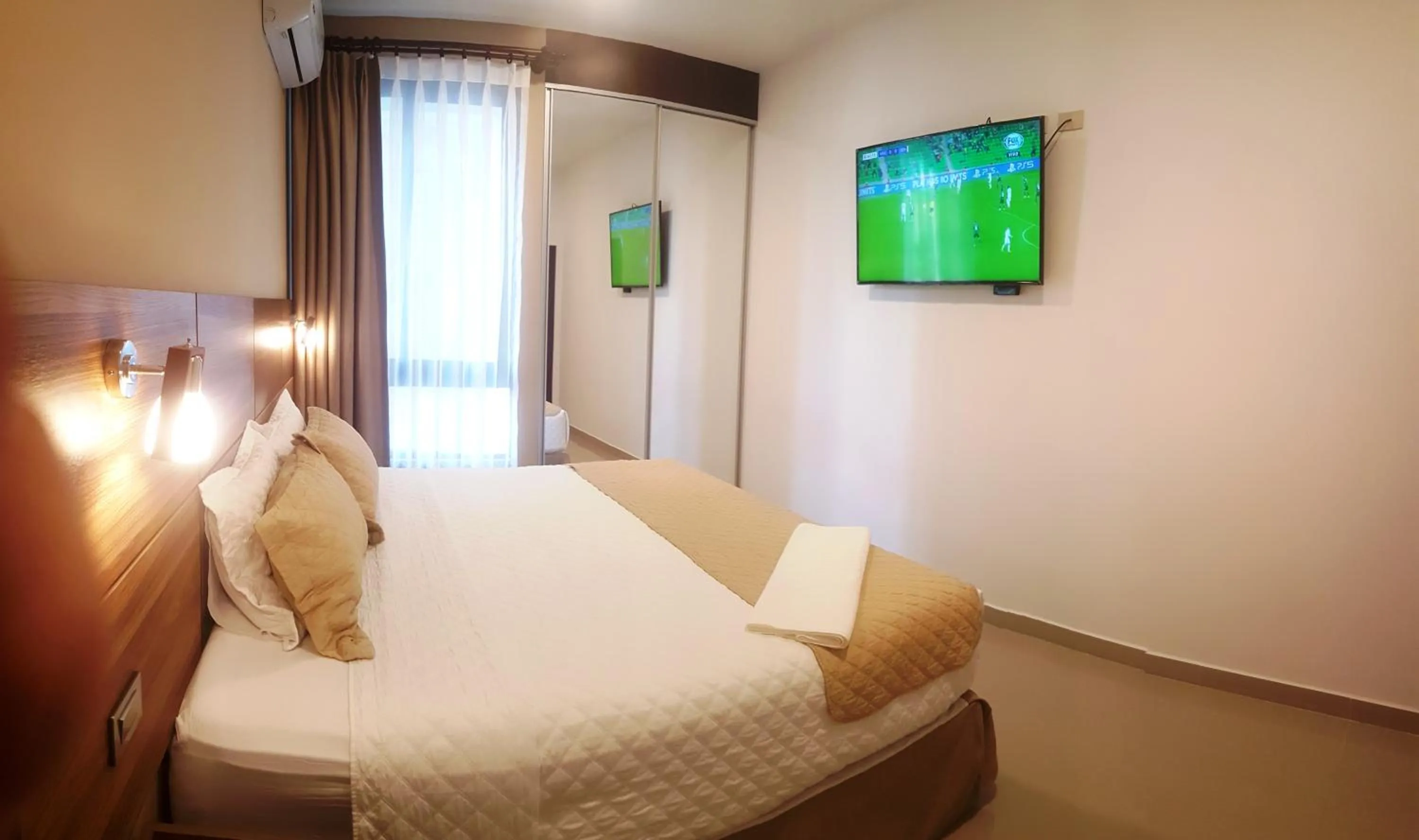 Bed in Premium Suites Deluxe Aparthotel Equipetrol