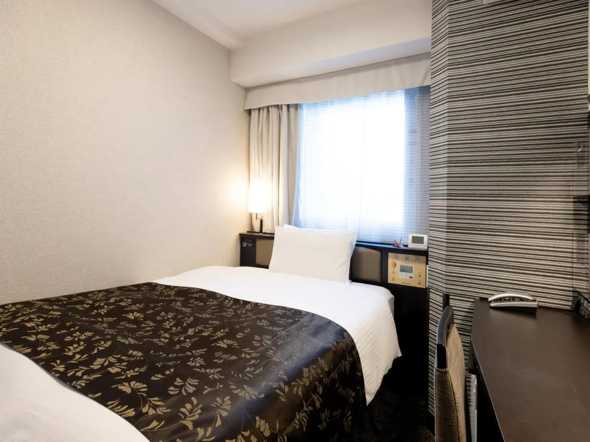 Bed in APA Hotel Nambaminami Ebisucho Eki Shinsekai