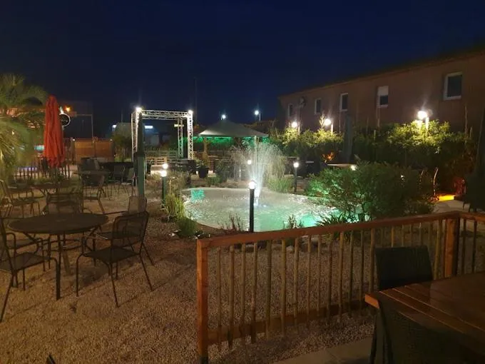 Patio in Logis Hôtel Acotel