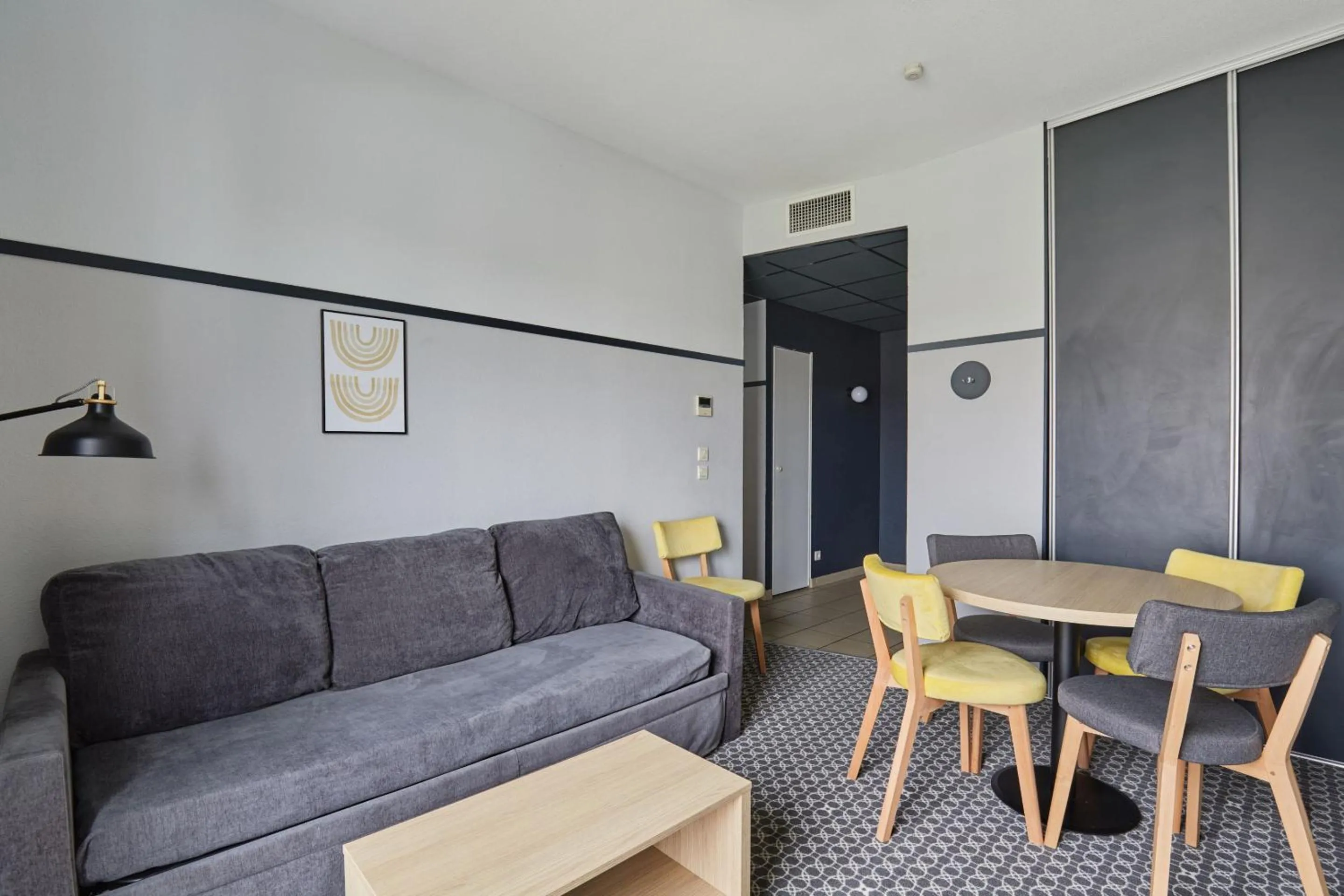Living room in Appart'hôtel Odalys City - Bioparc Lyon Est