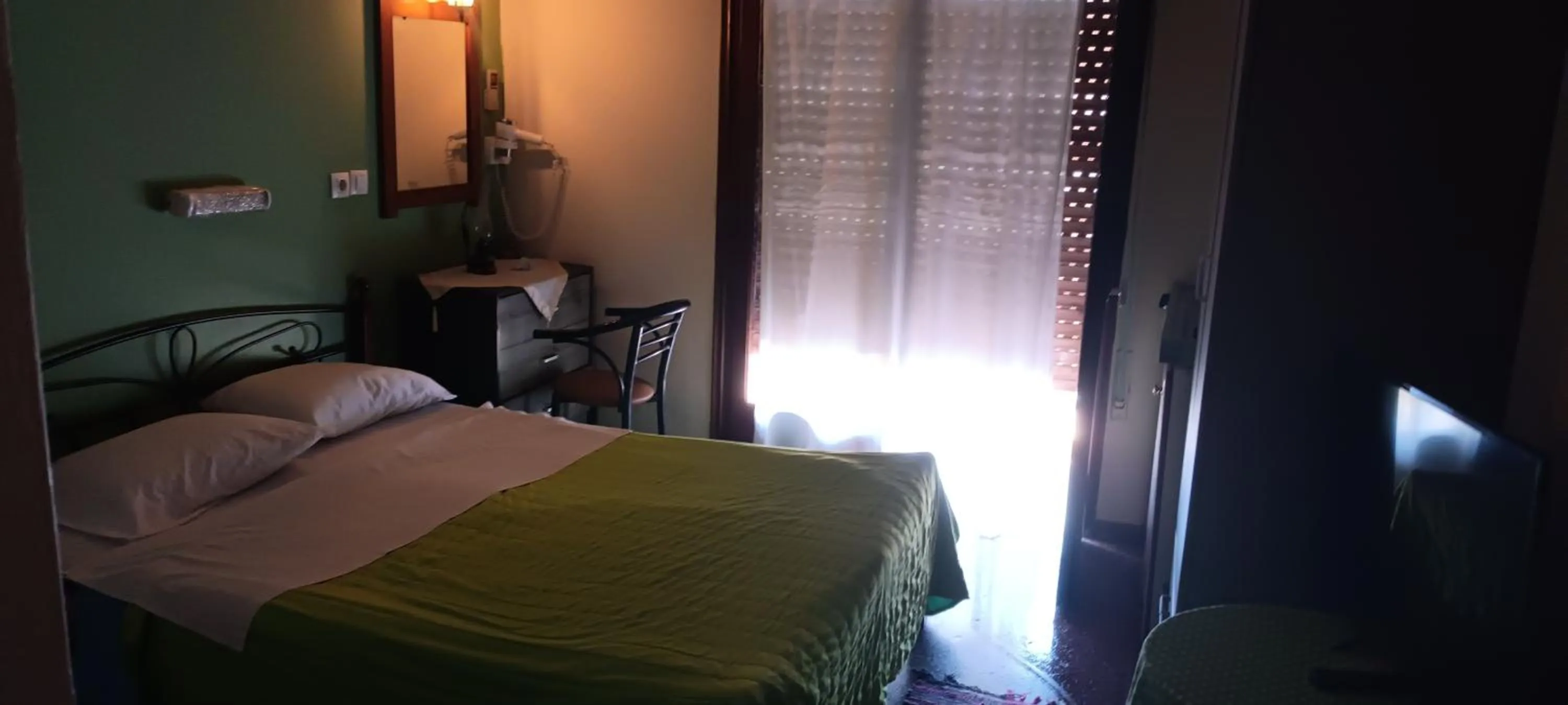 Bed in Hotel zakros rooms-restaurant