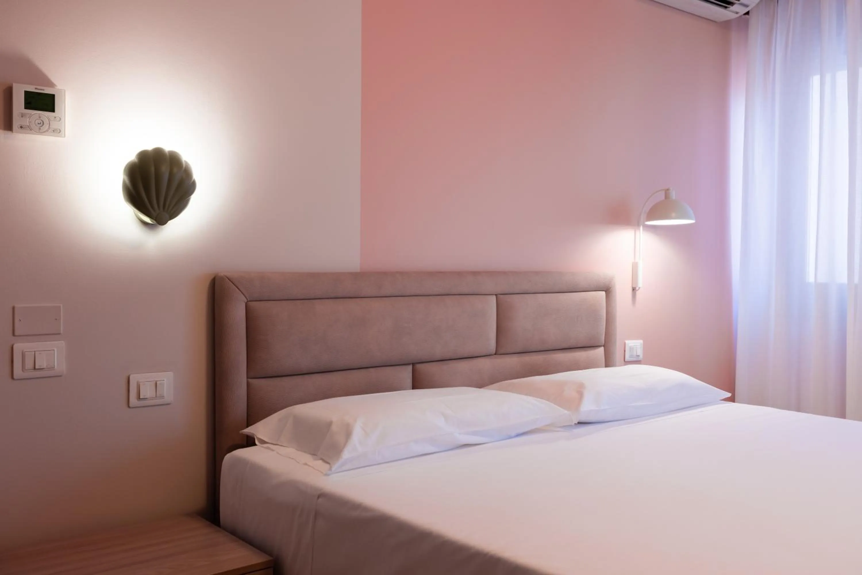 Bed in La Vista Postcard Hotel