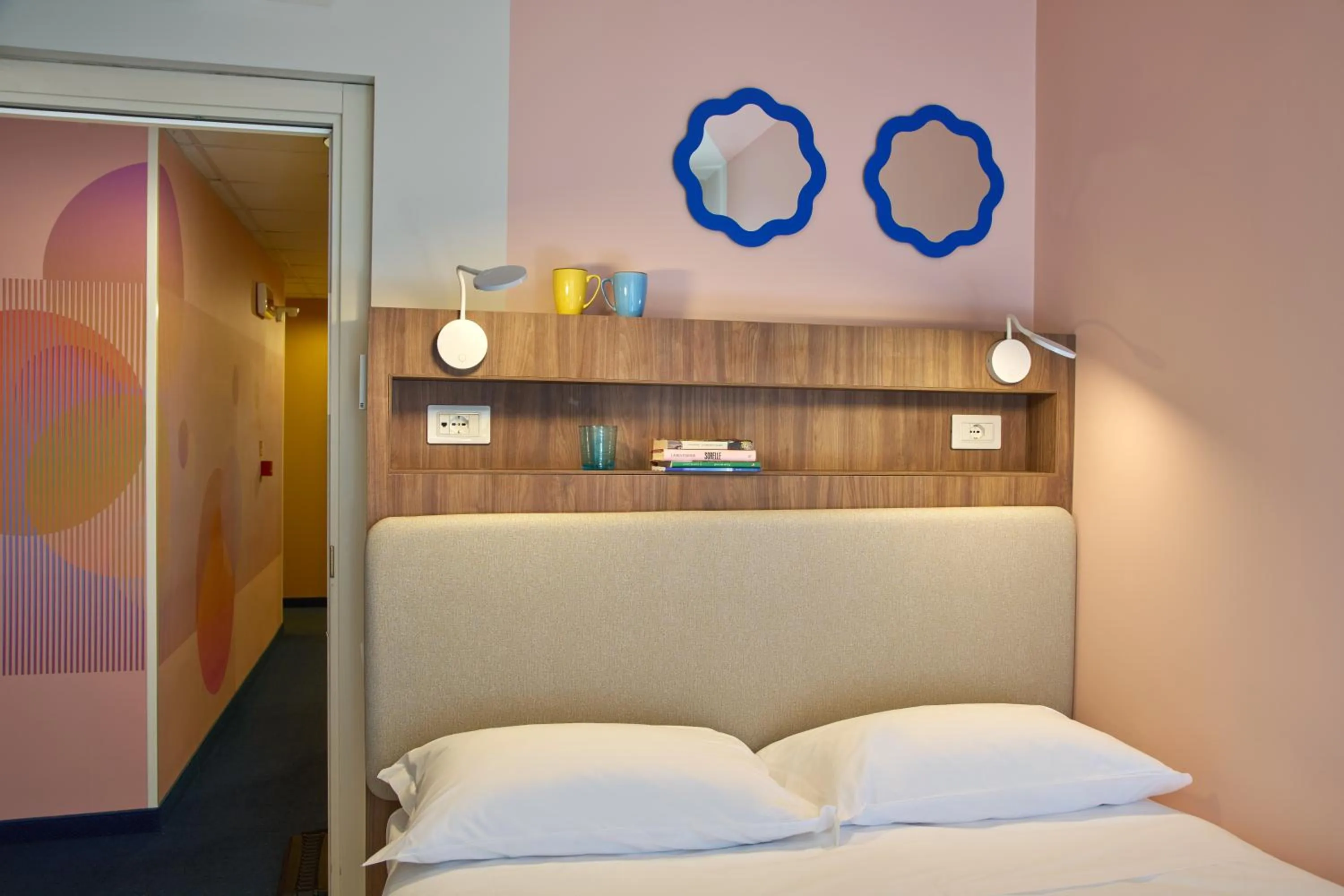 Bed in La Vista Postcard Hotel