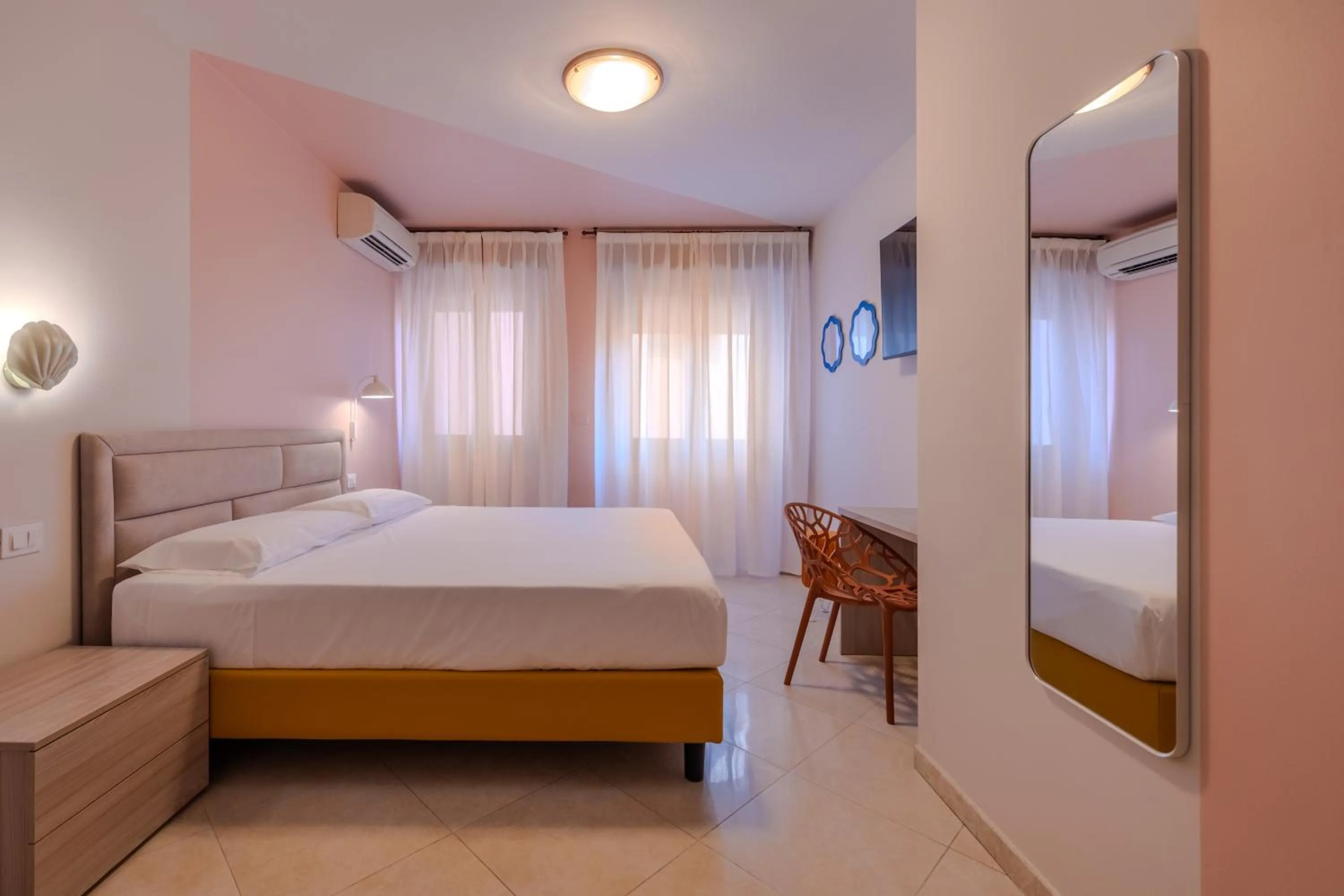 Bed in La Vista Postcard Hotel