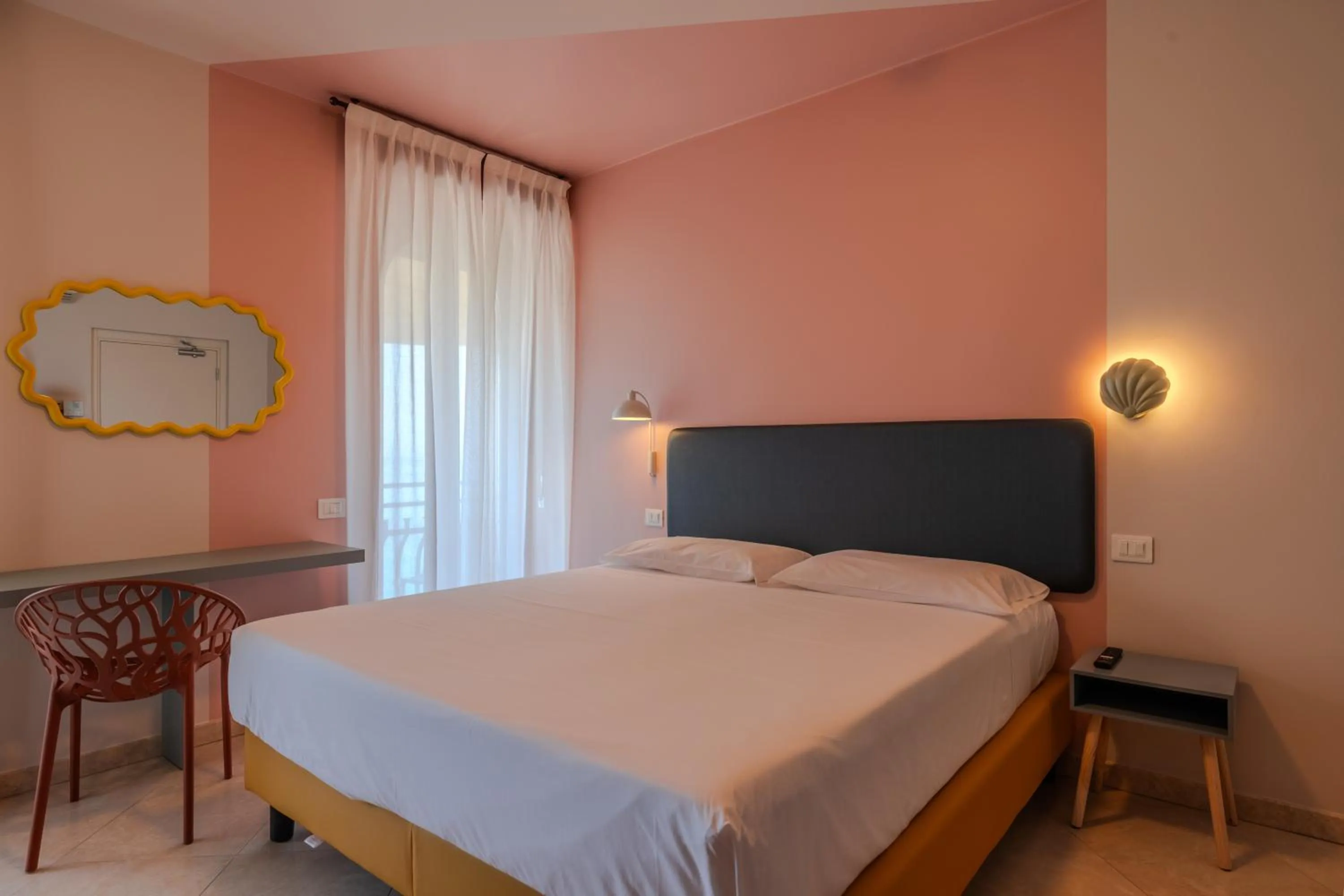 Bed in La Vista Postcard Hotel