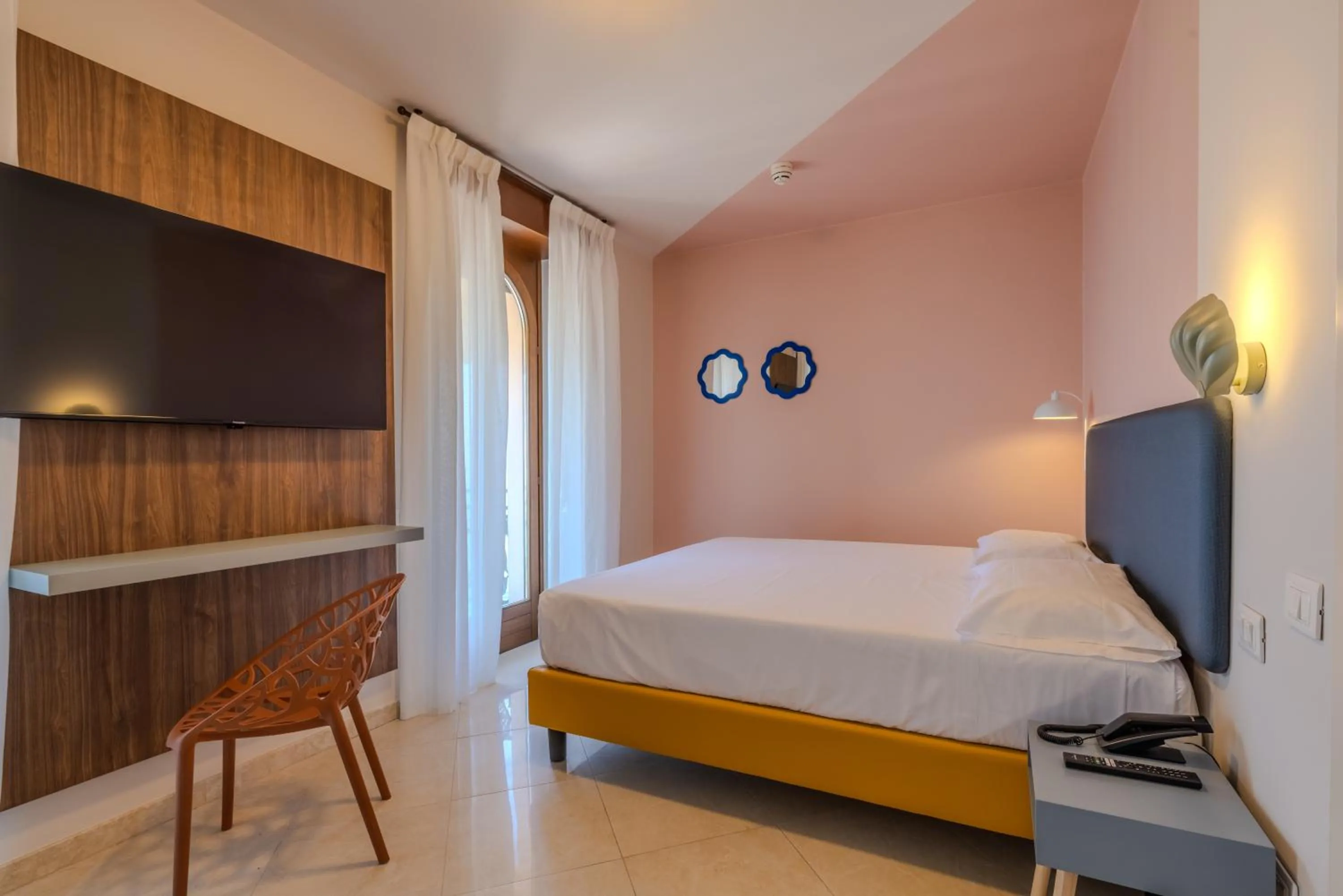 Bed in La Vista Postcard Hotel