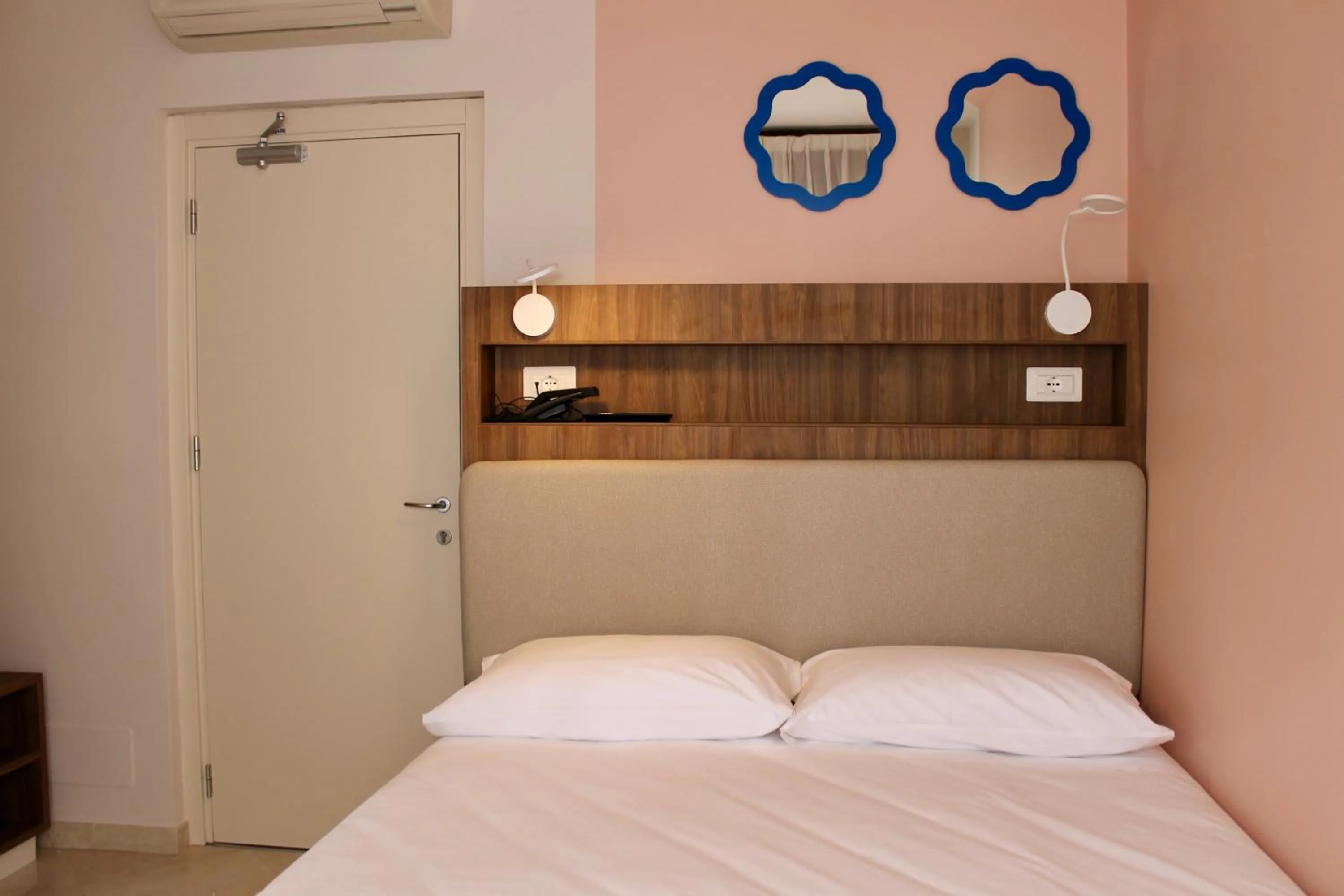 Bed in La Vista Postcard Hotel