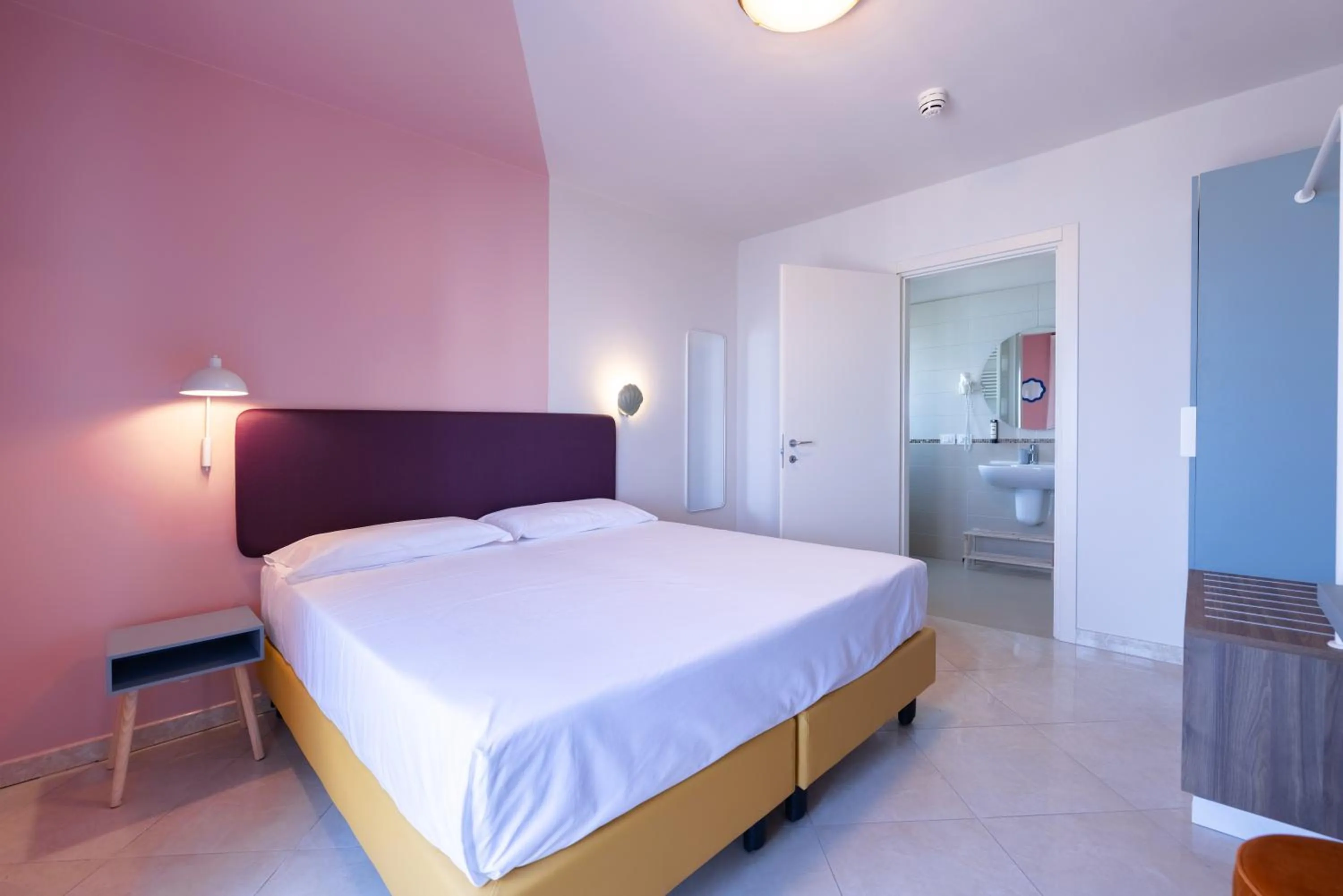 Bed in La Vista Postcard Hotel