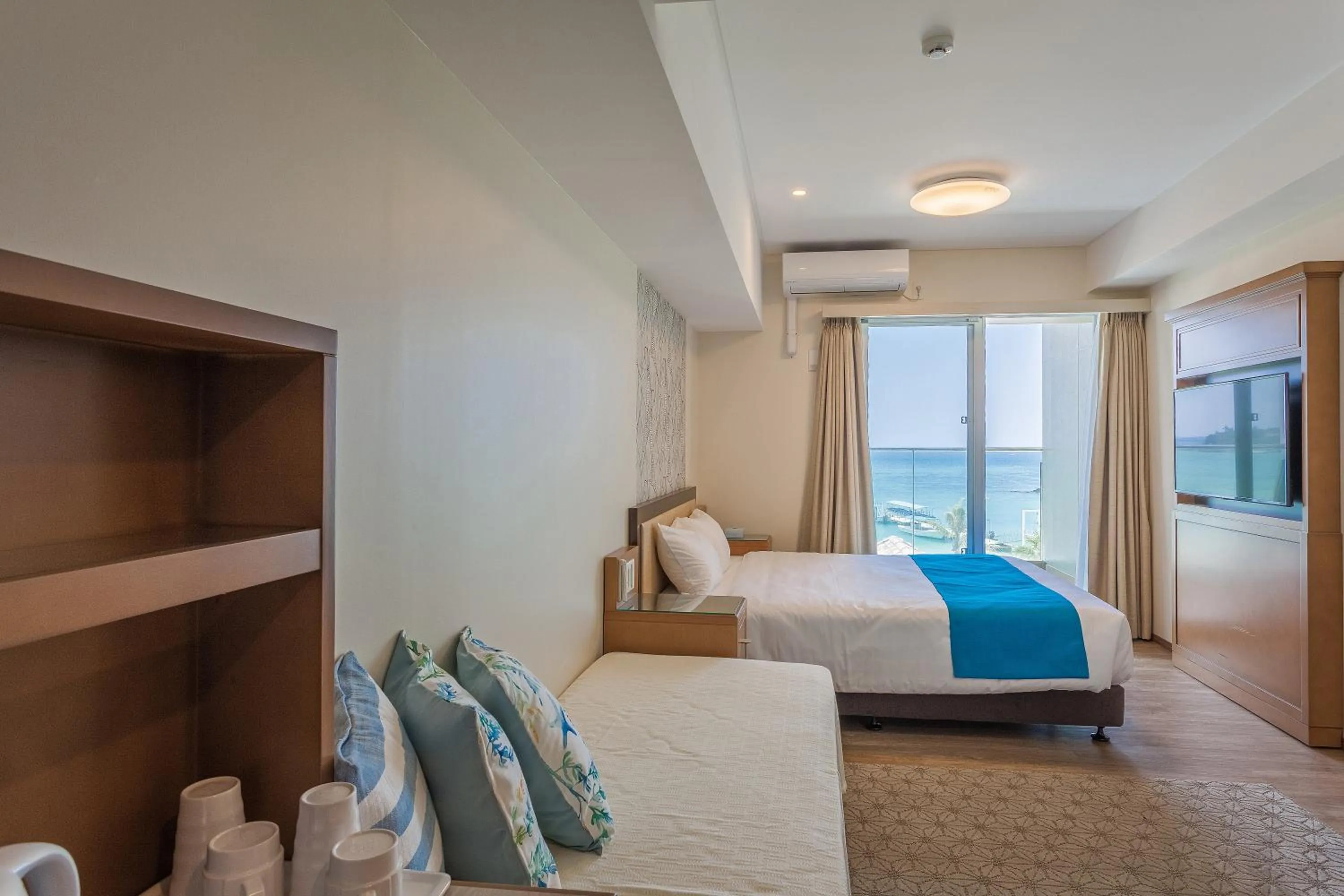 Photo of the whole room, Bed in Kariyushi LCH. Resort