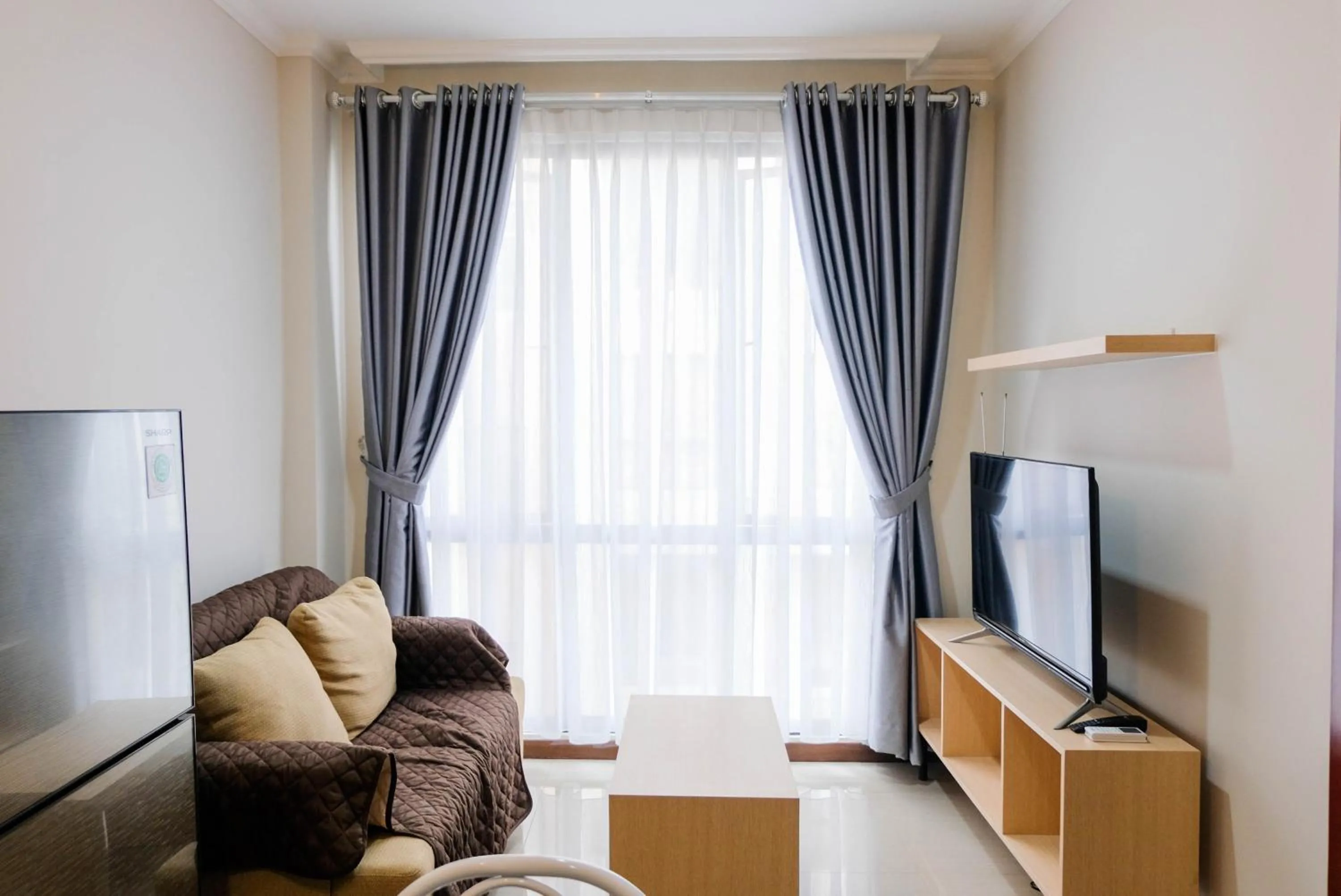 Warm and Relax 1BR at Asatti Garden House Apartment By Travelio
