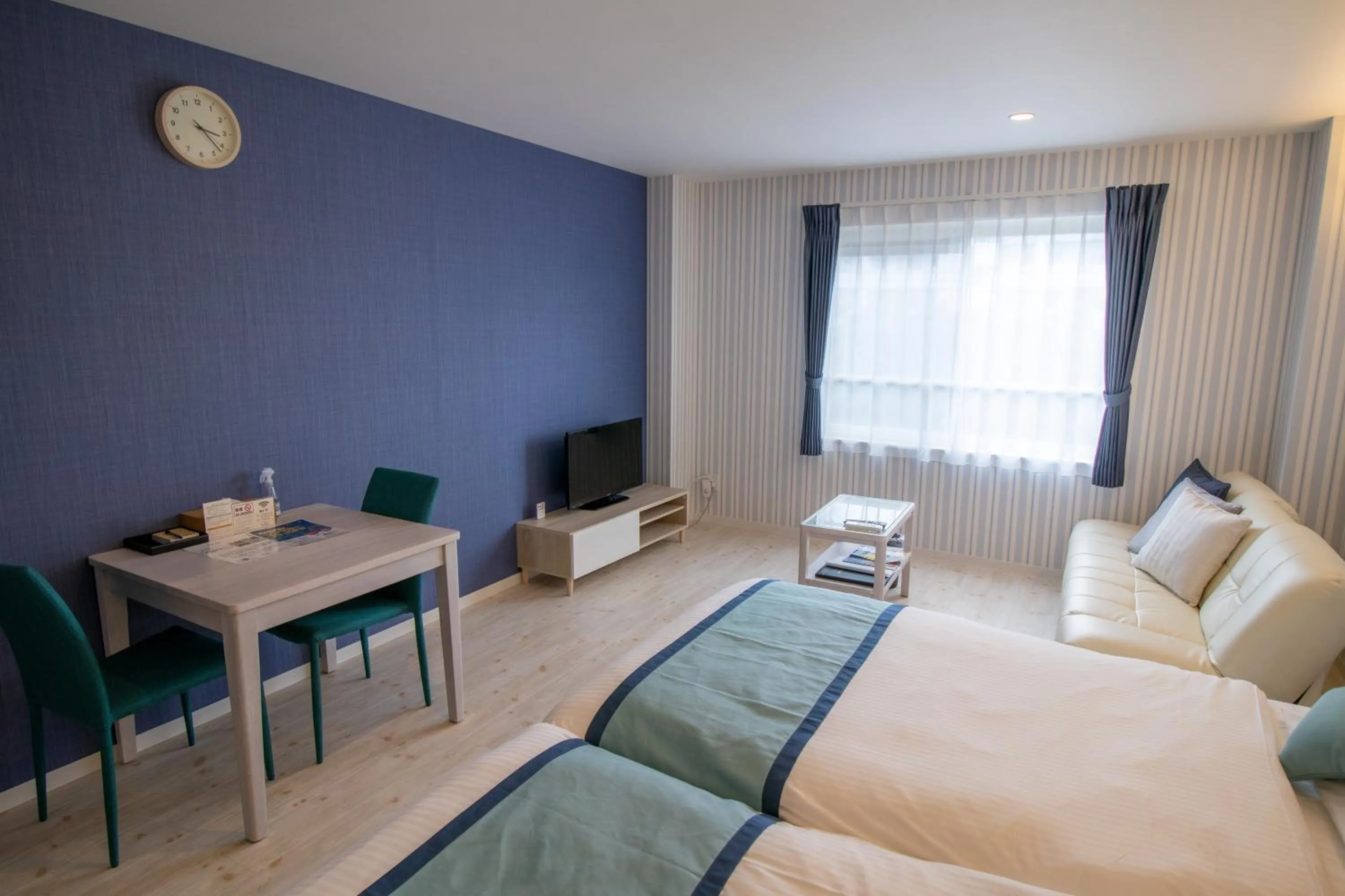 Living room, Bed in Pine Hills Hotel Miyakojima