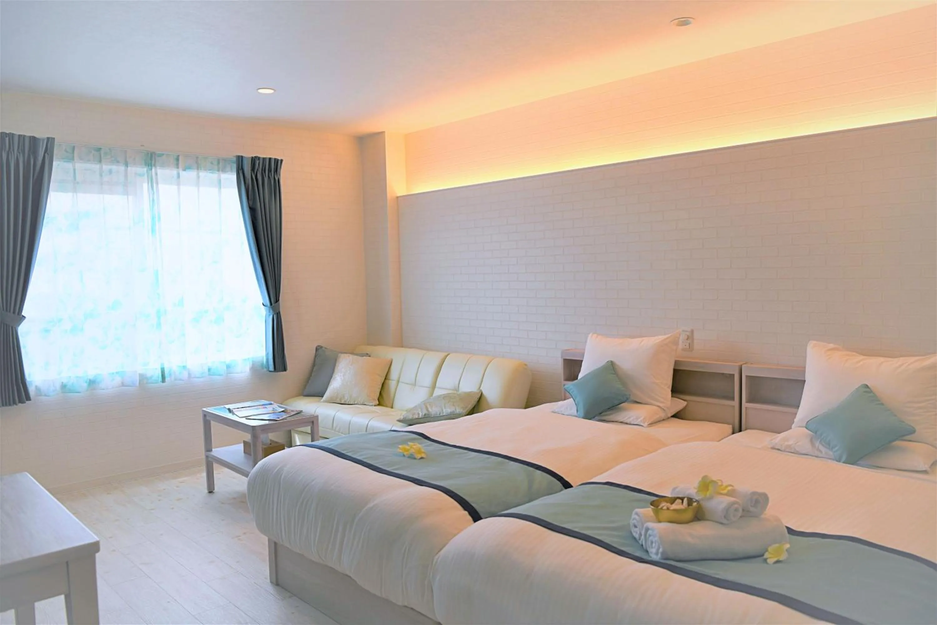 Bed in Pine Hills Hotel Miyakojima