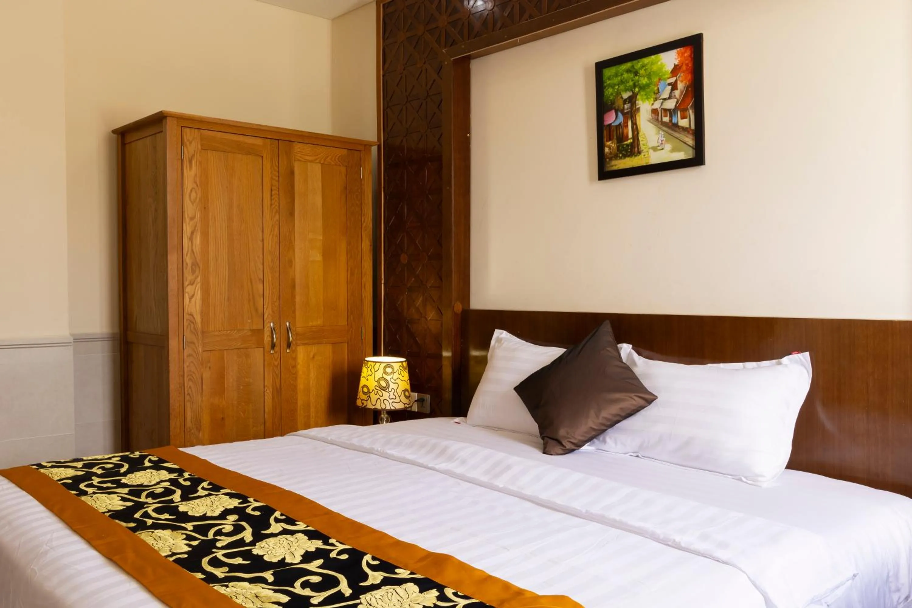 Bed in California Saigon Hotel