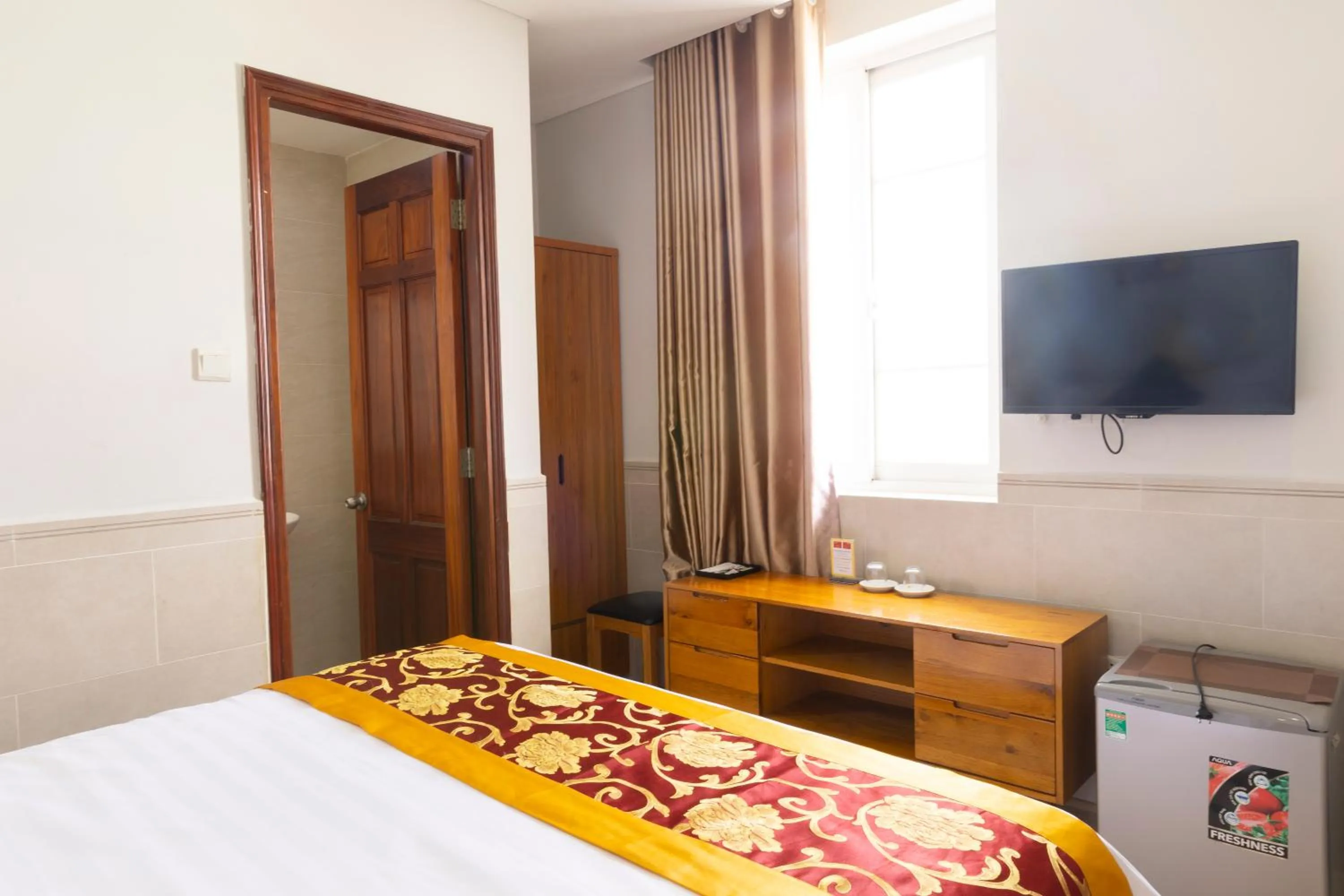 Bed in California Saigon Hotel