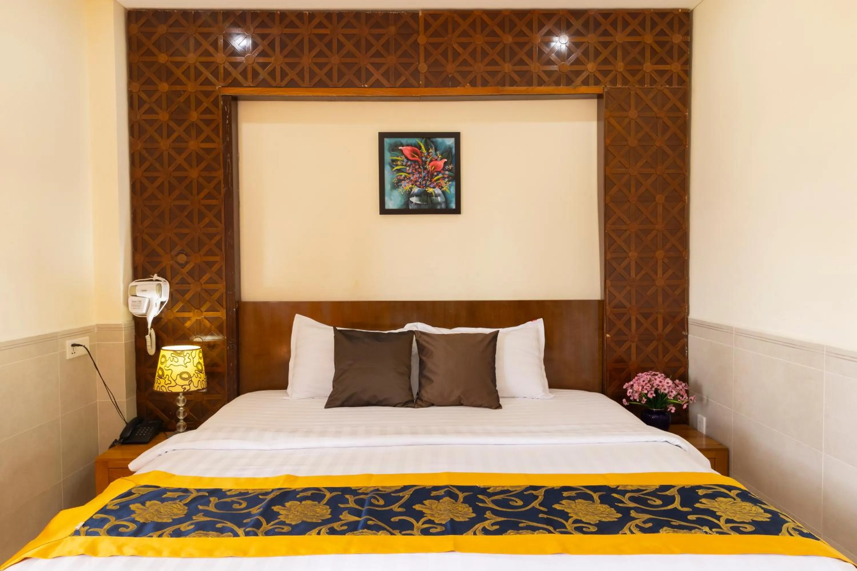 Bed in California Saigon Hotel