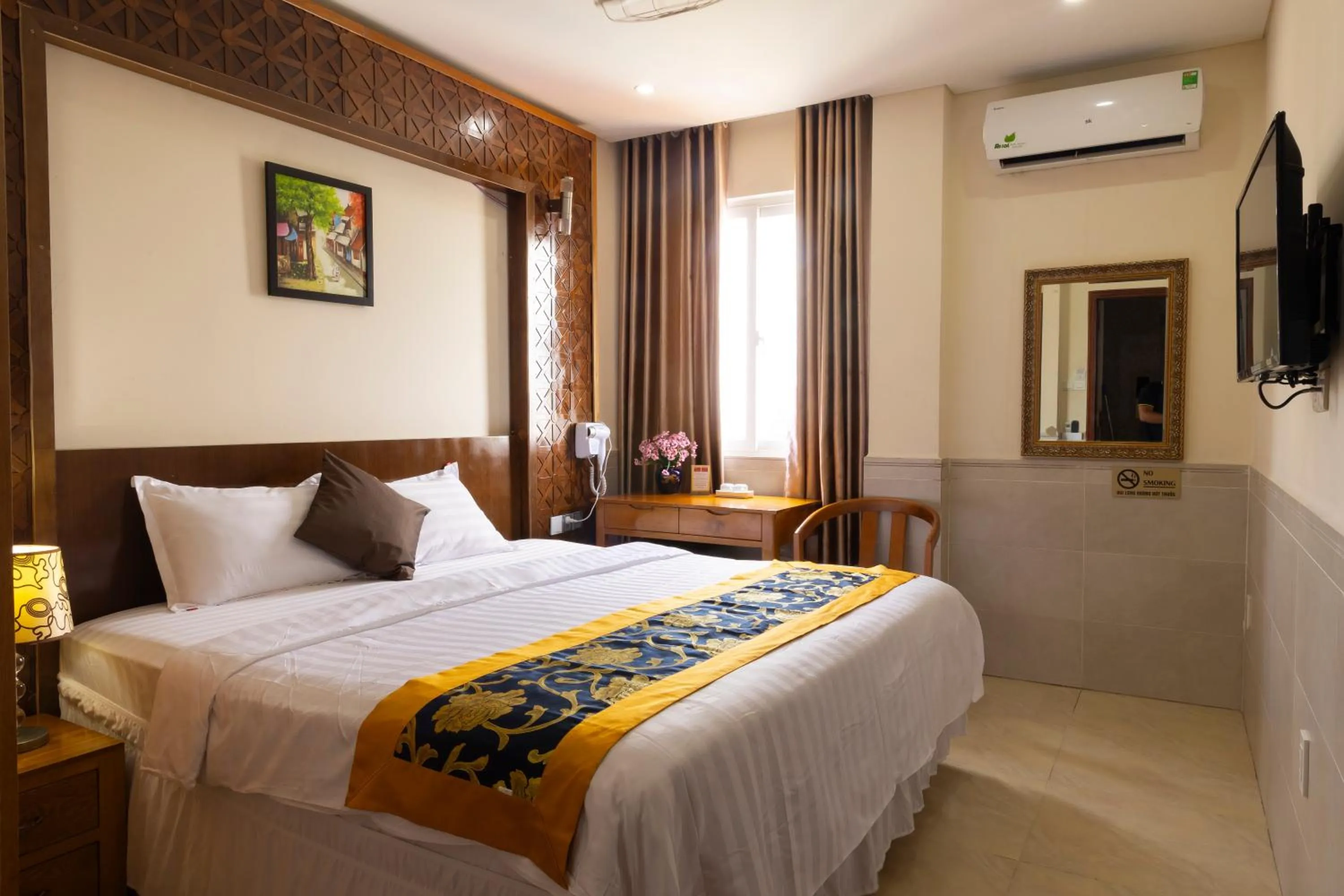 Bed in California Saigon Hotel