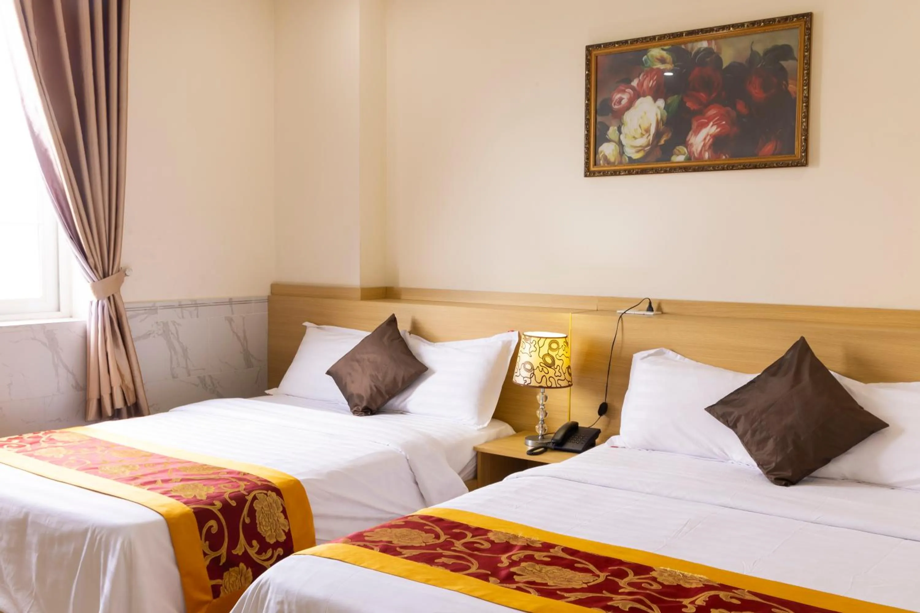 Bed in California Saigon Hotel