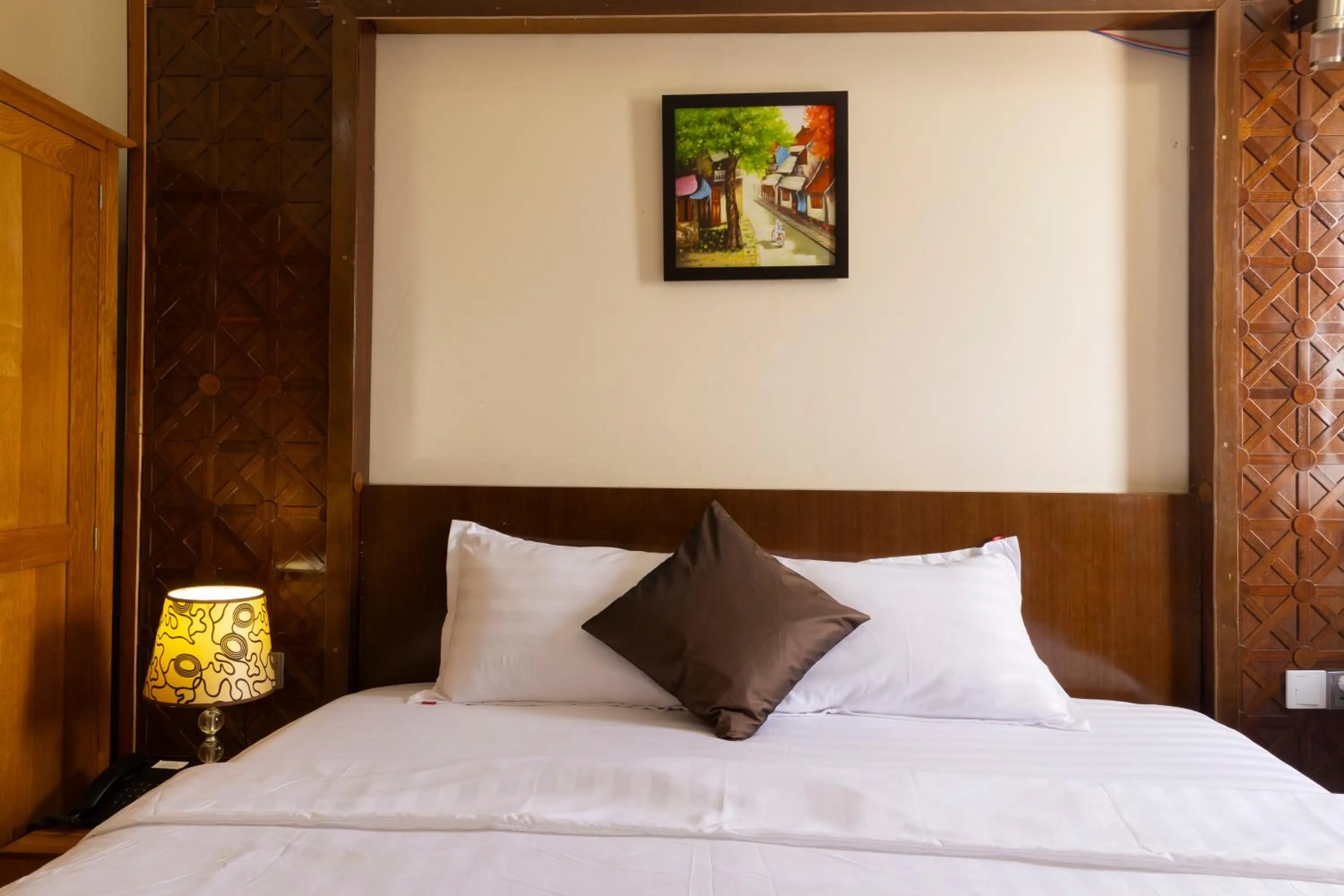 Bed in California Saigon Hotel