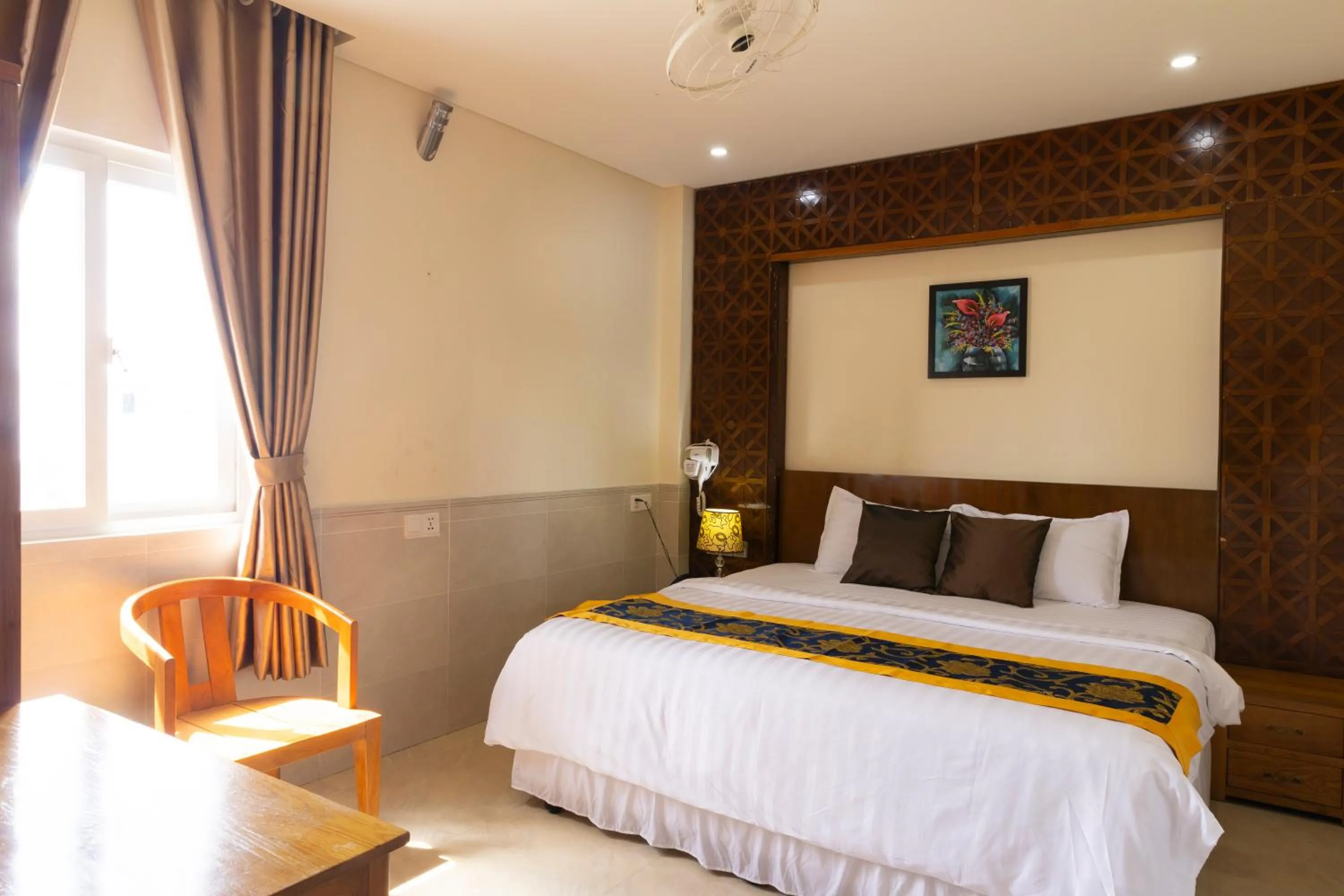 Bed in California Saigon Hotel