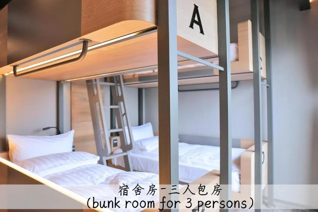 Bed in KIWI SHARE HOTEL ZHONGLI