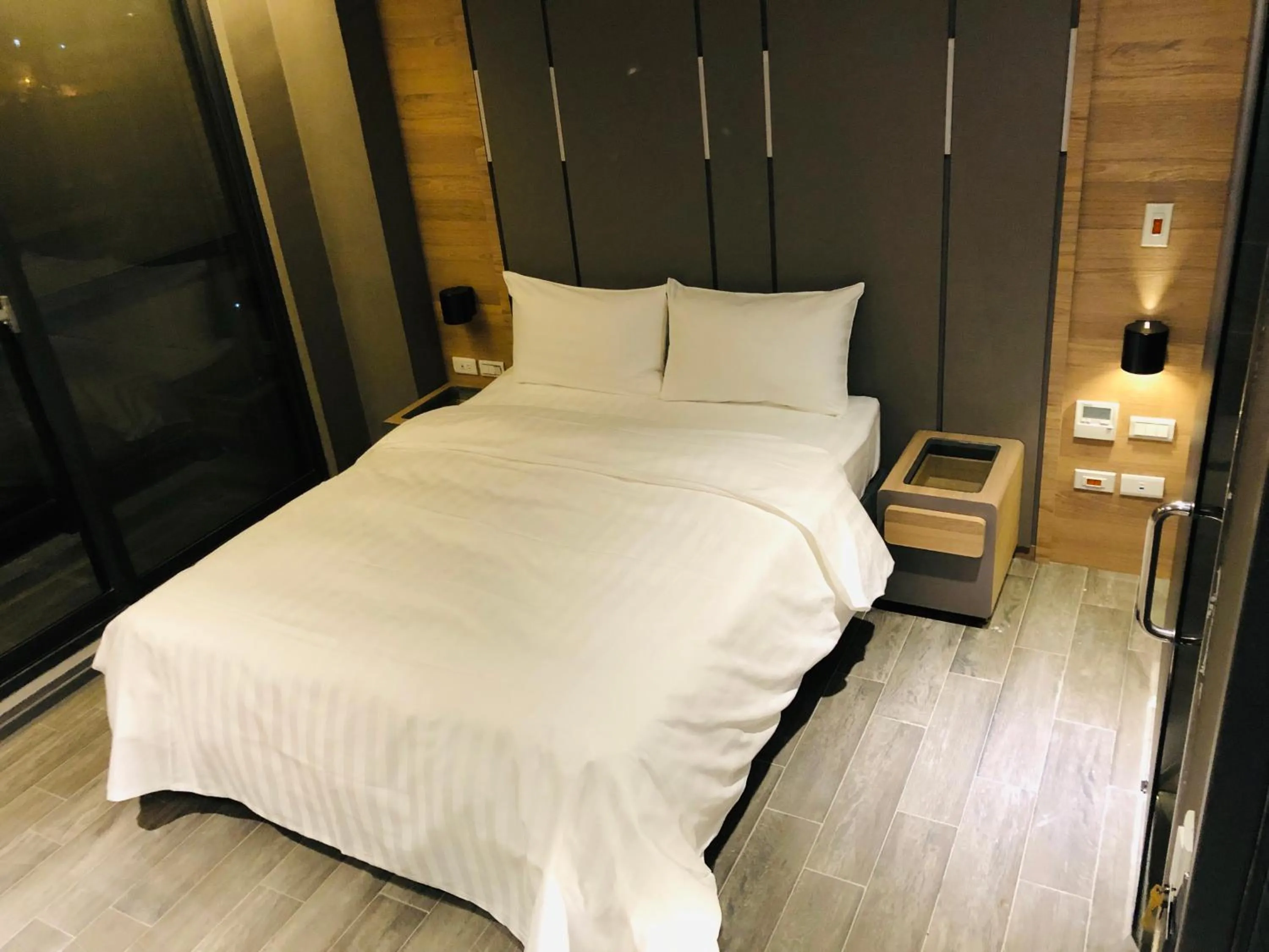 Bed in KIWI SHARE HOTEL ZHONGLI