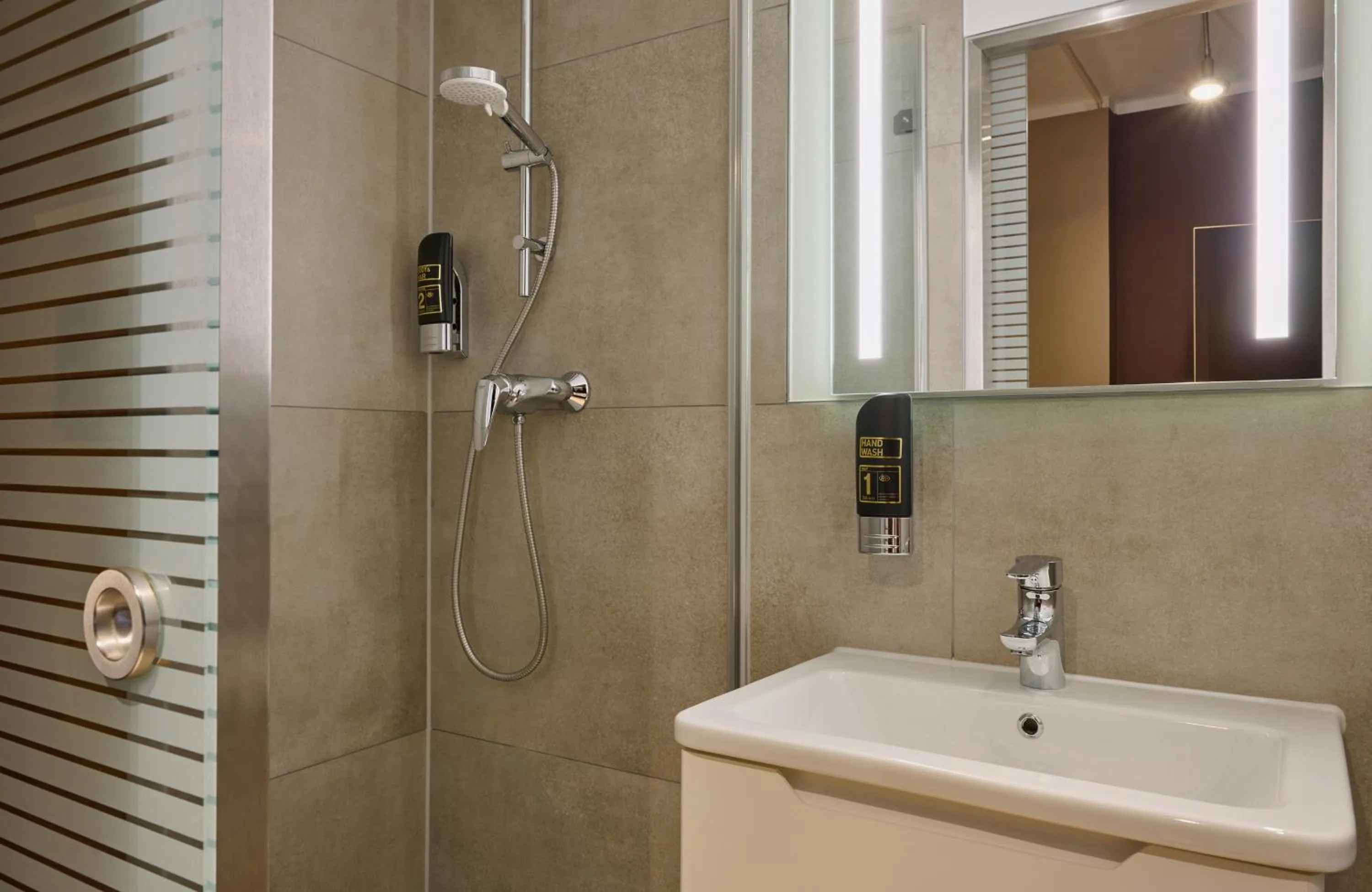 Bathroom in Leonardo Boutique Hotel Munich