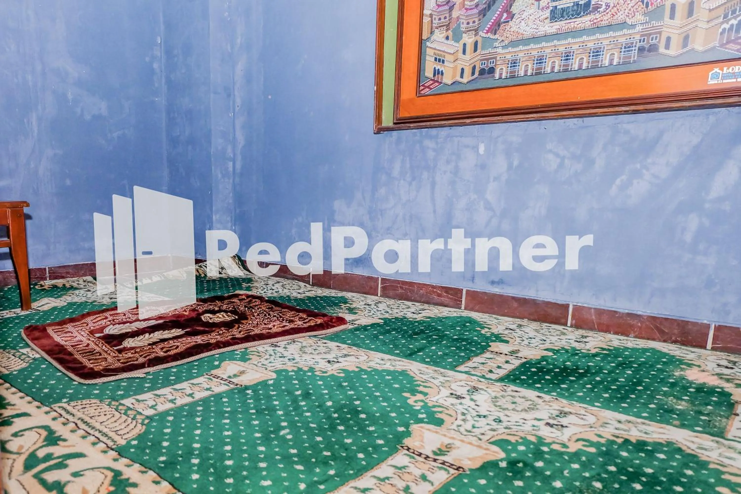 Place of worship, Bed in Hotel Sebelas at Jalan Palasari Mitra RedDoorz