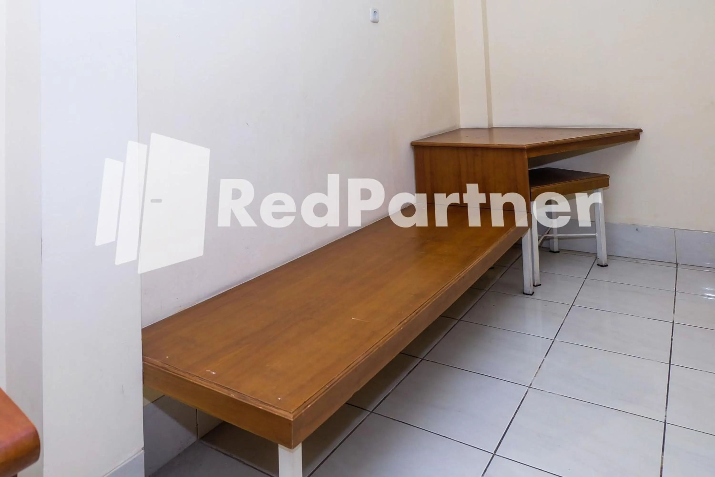 Bedroom in Hotel Sebelas at Jalan Palasari Mitra RedDoorz