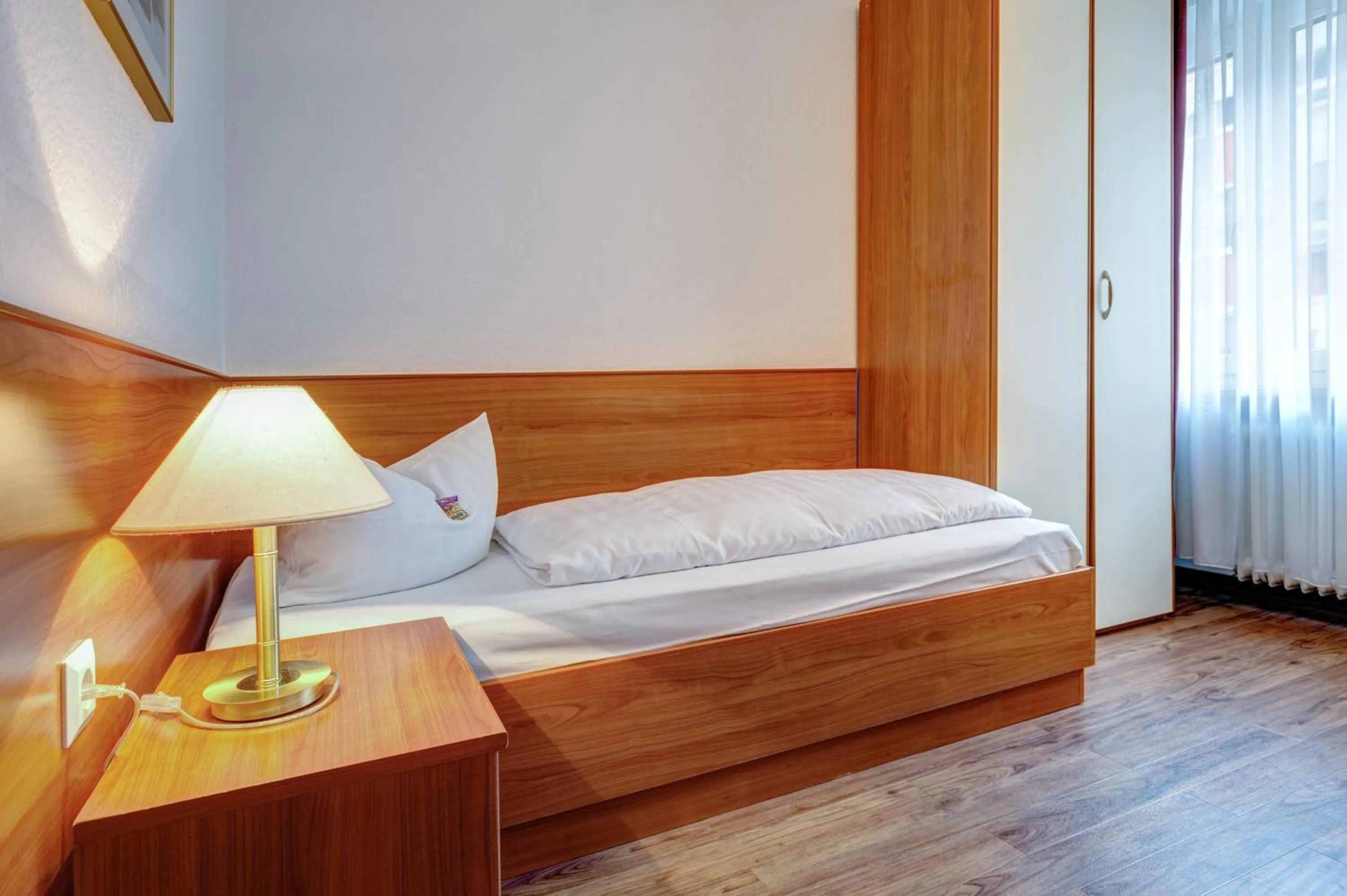 Bed in Hotel Antares München