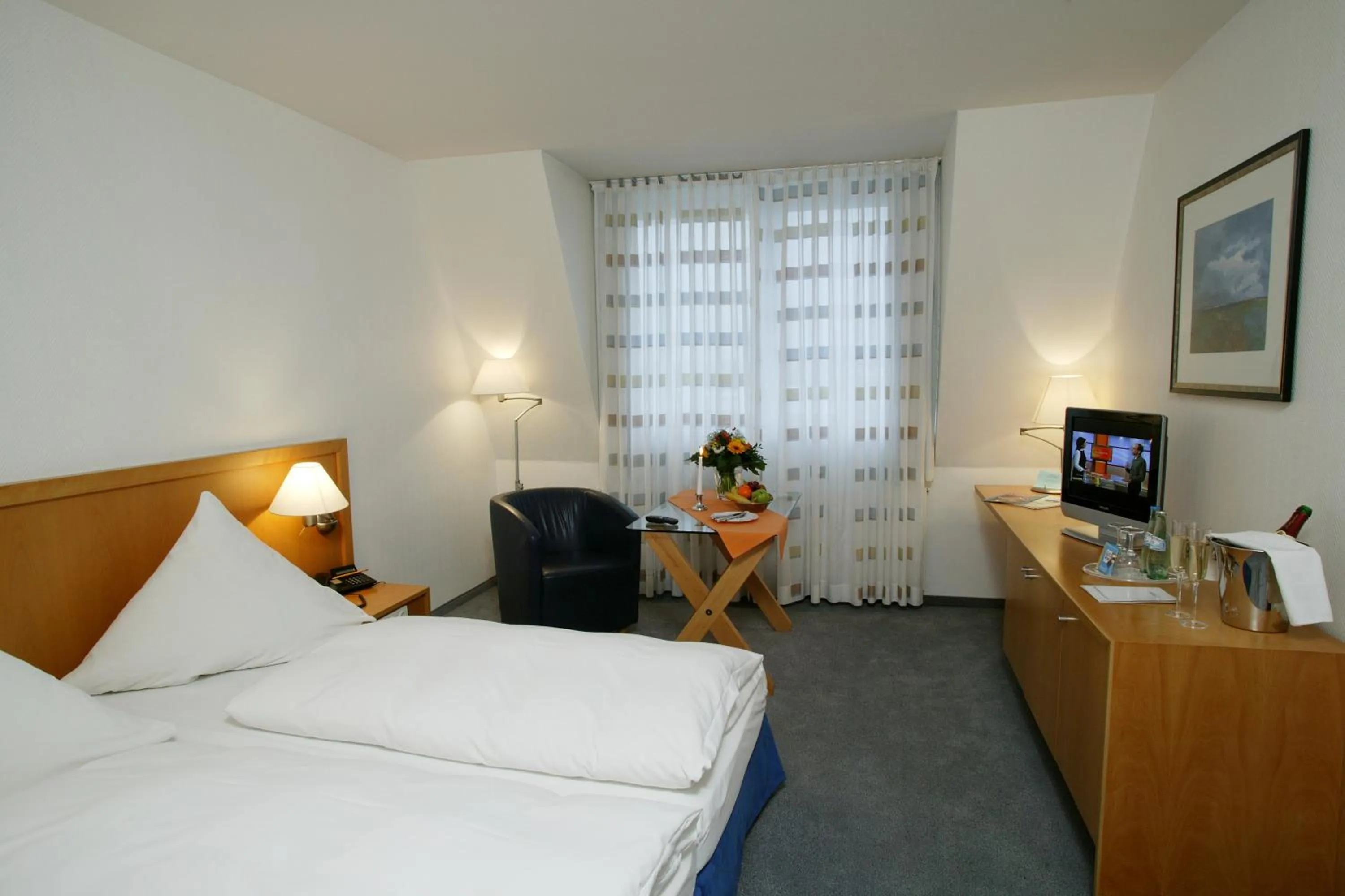 Photo of the whole room, Bed in Stadthotel Oranienburg