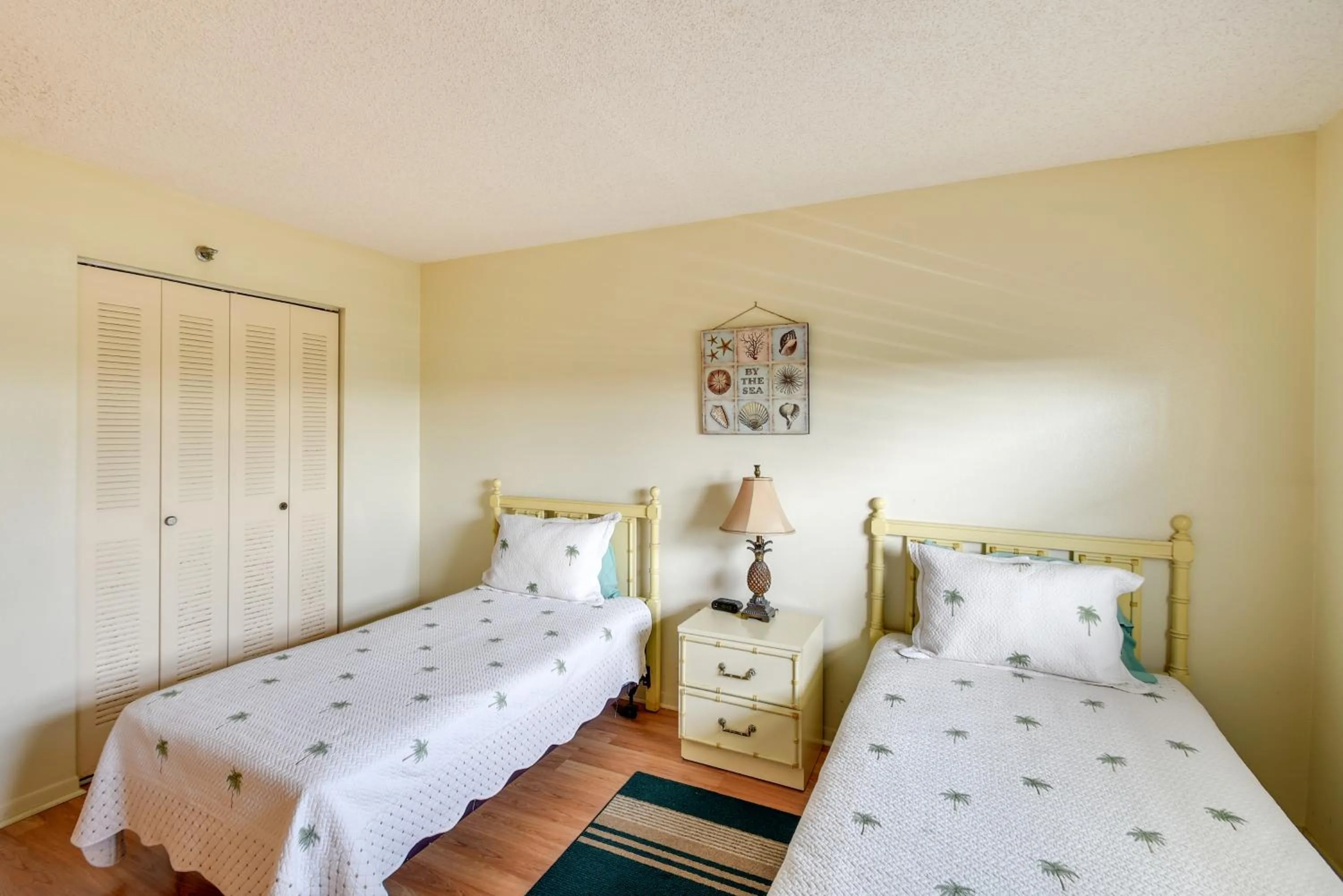 Bed in Walk to Madeira Beach Coastal Condo with Balcony