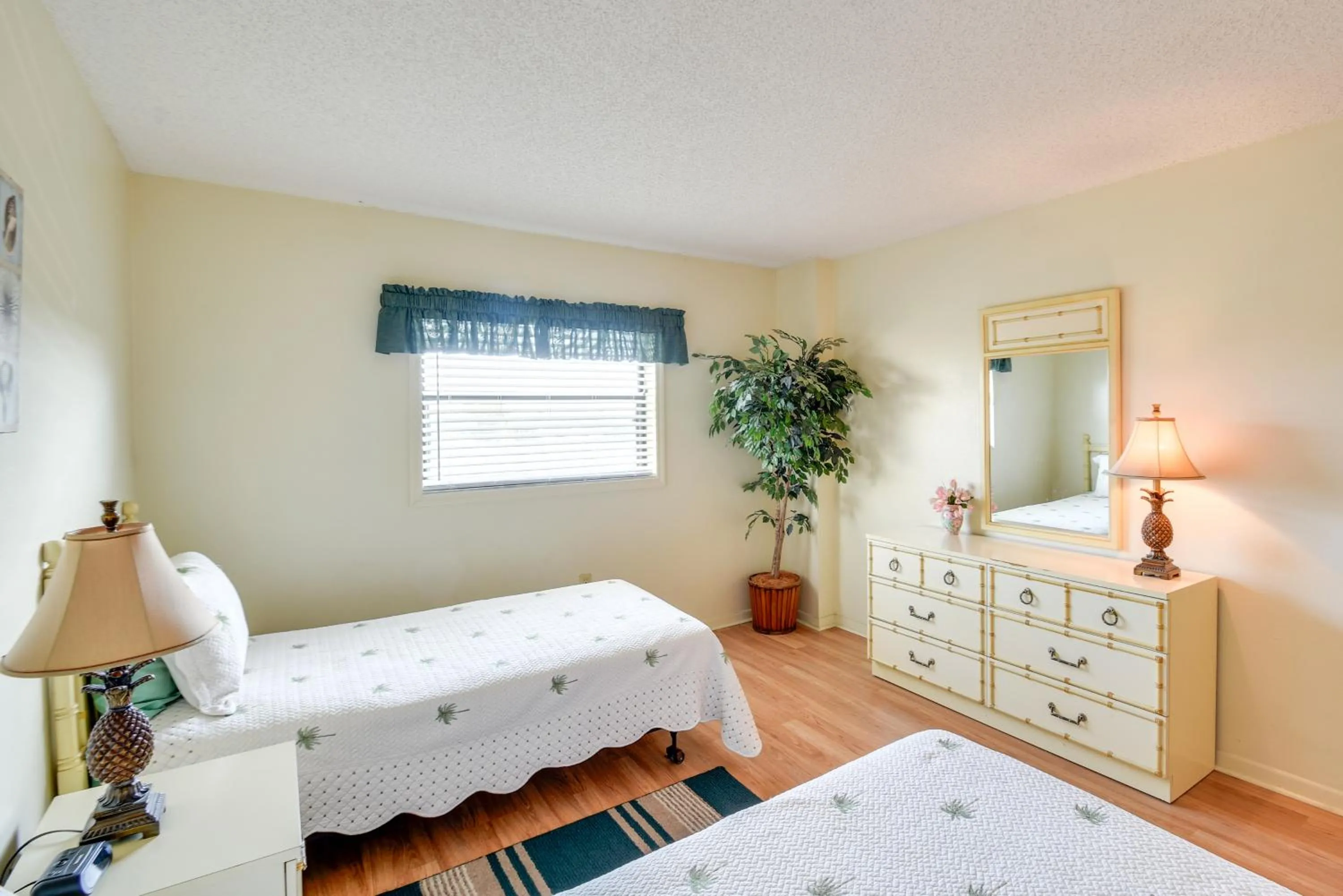 Bed in Walk to Madeira Beach Coastal Condo with Balcony