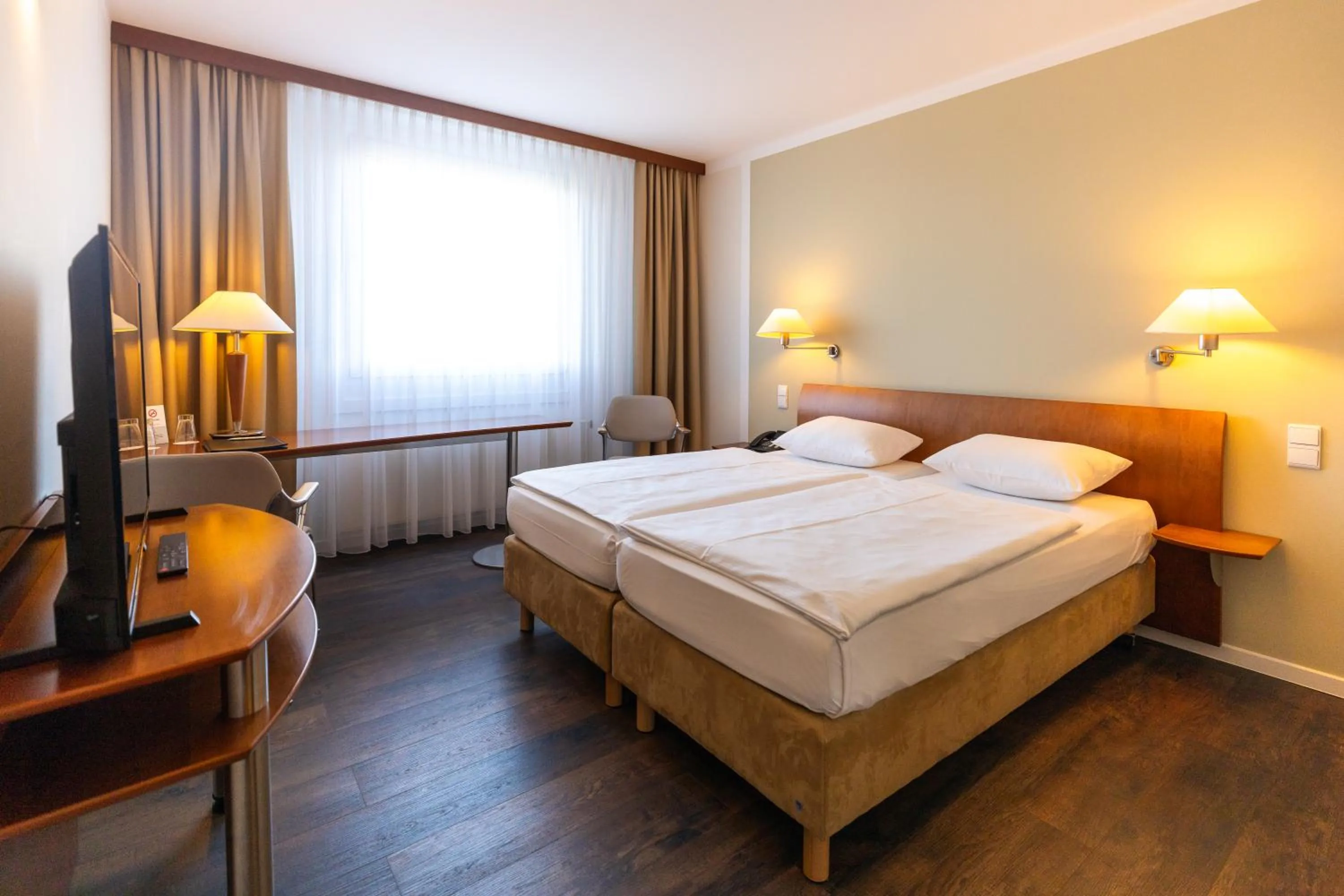 Communal lounge/ TV room, Bed in Globana Airport Hotel