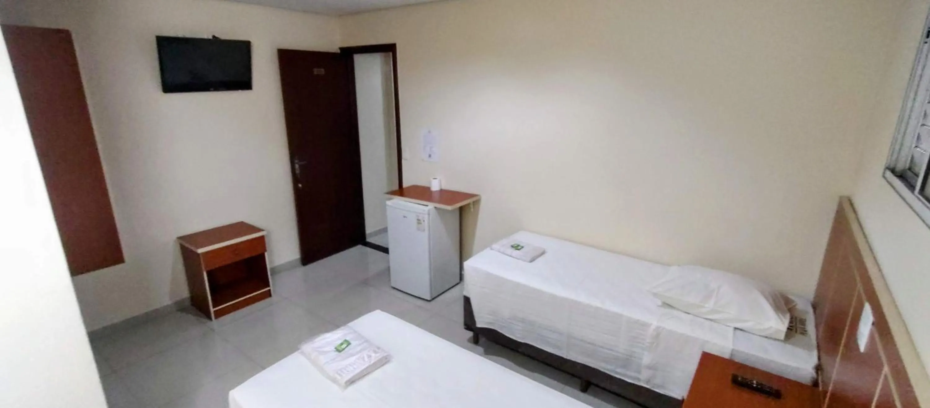 Bed in Aero Plaza Hotel