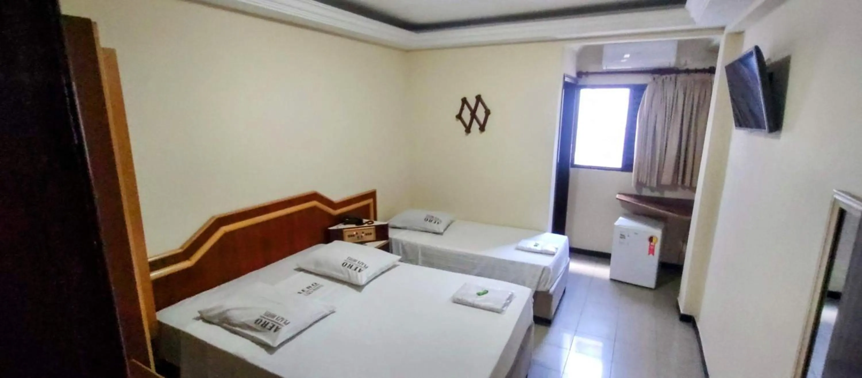 Bed in Aero Plaza Hotel