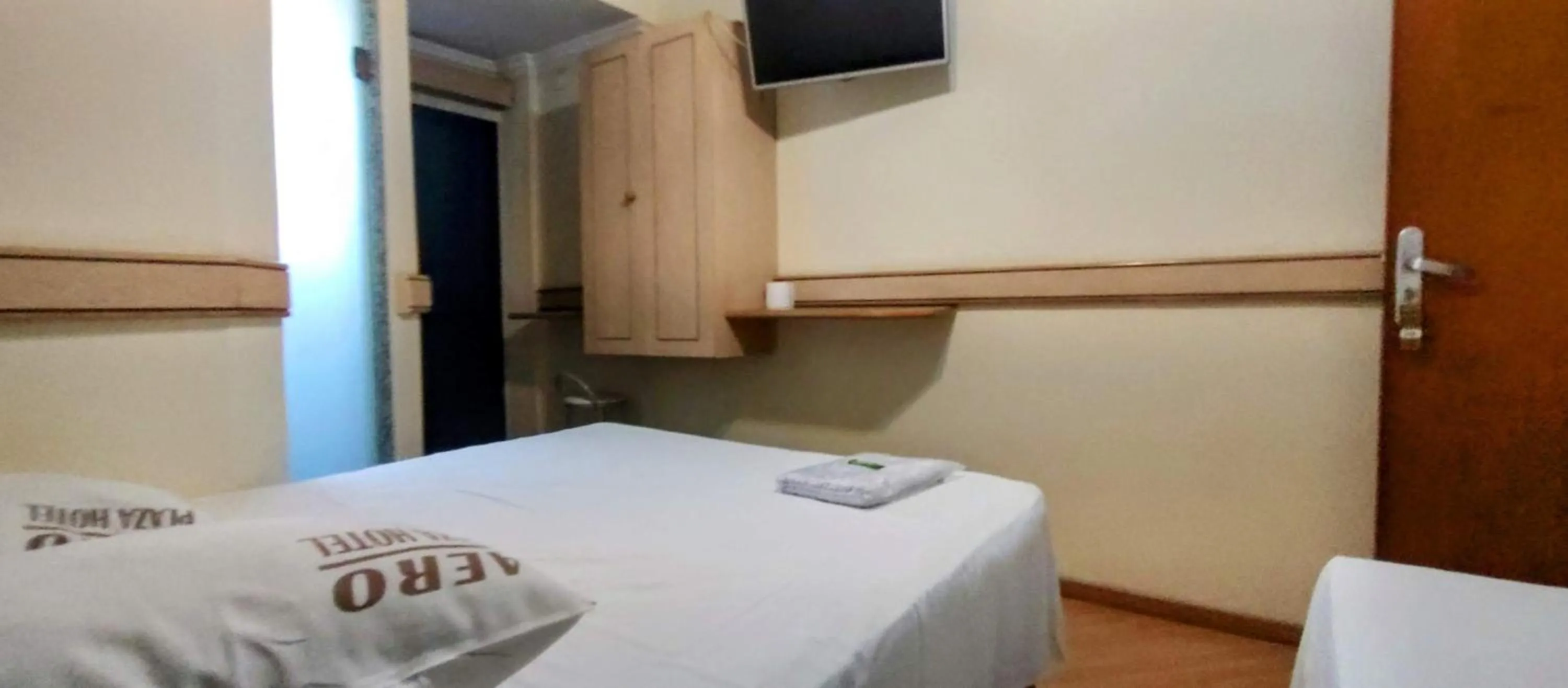 Bed in Aero Plaza Hotel