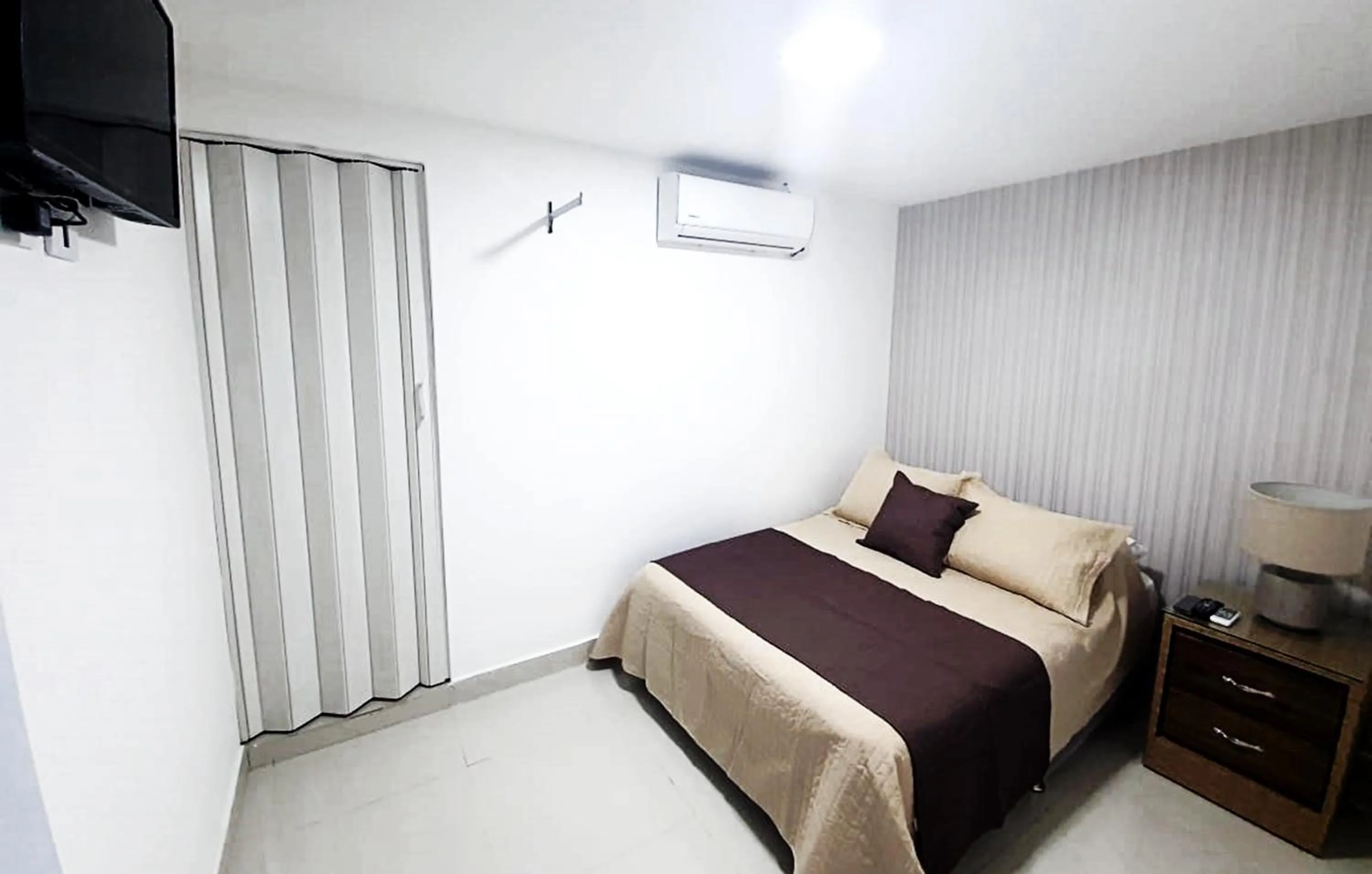 Bed in Malecon Premium Rooms & Hotel