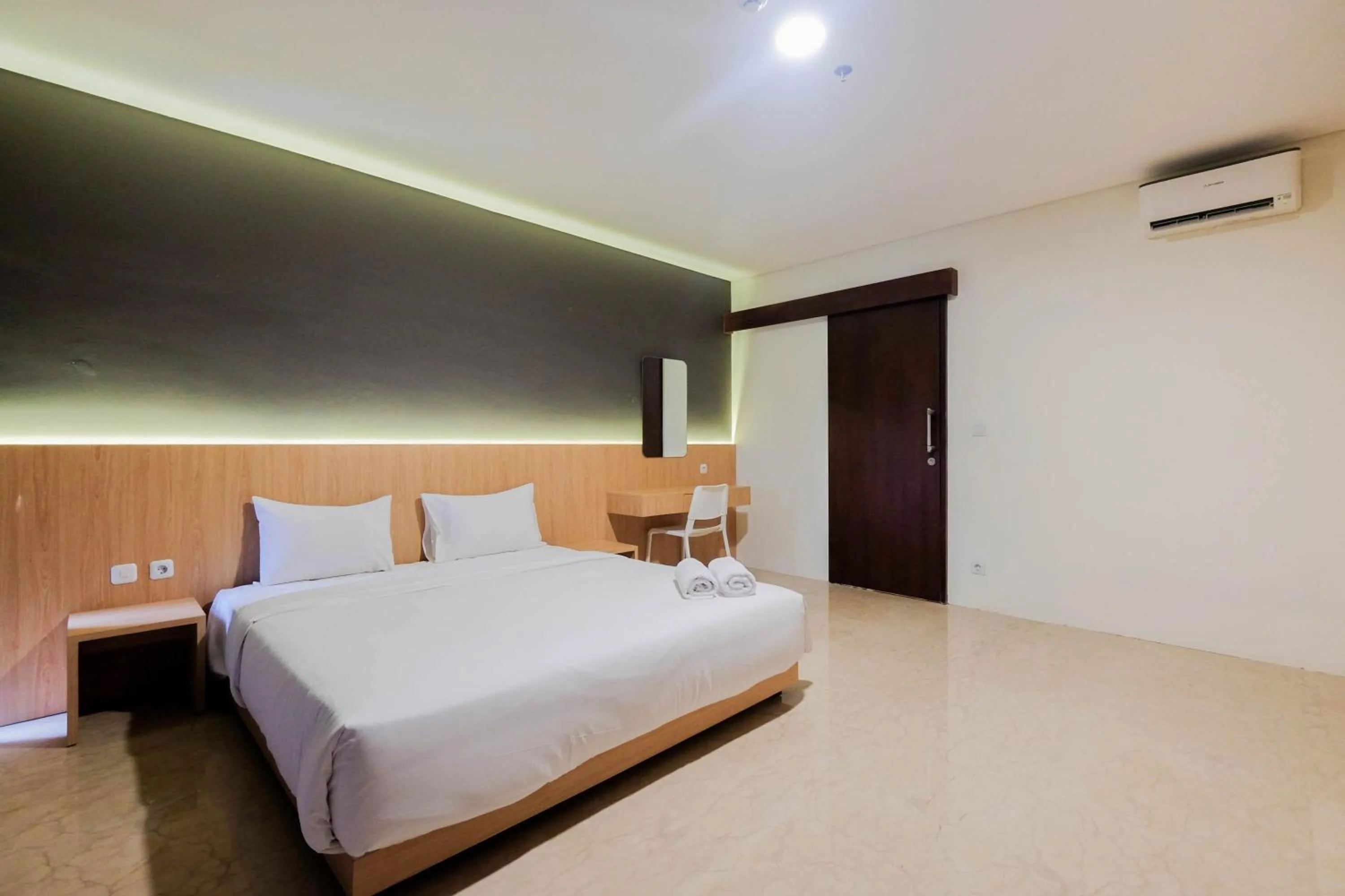 Bed in 1BR Pancoran L'Avenue Comfy Apartment By Travelio