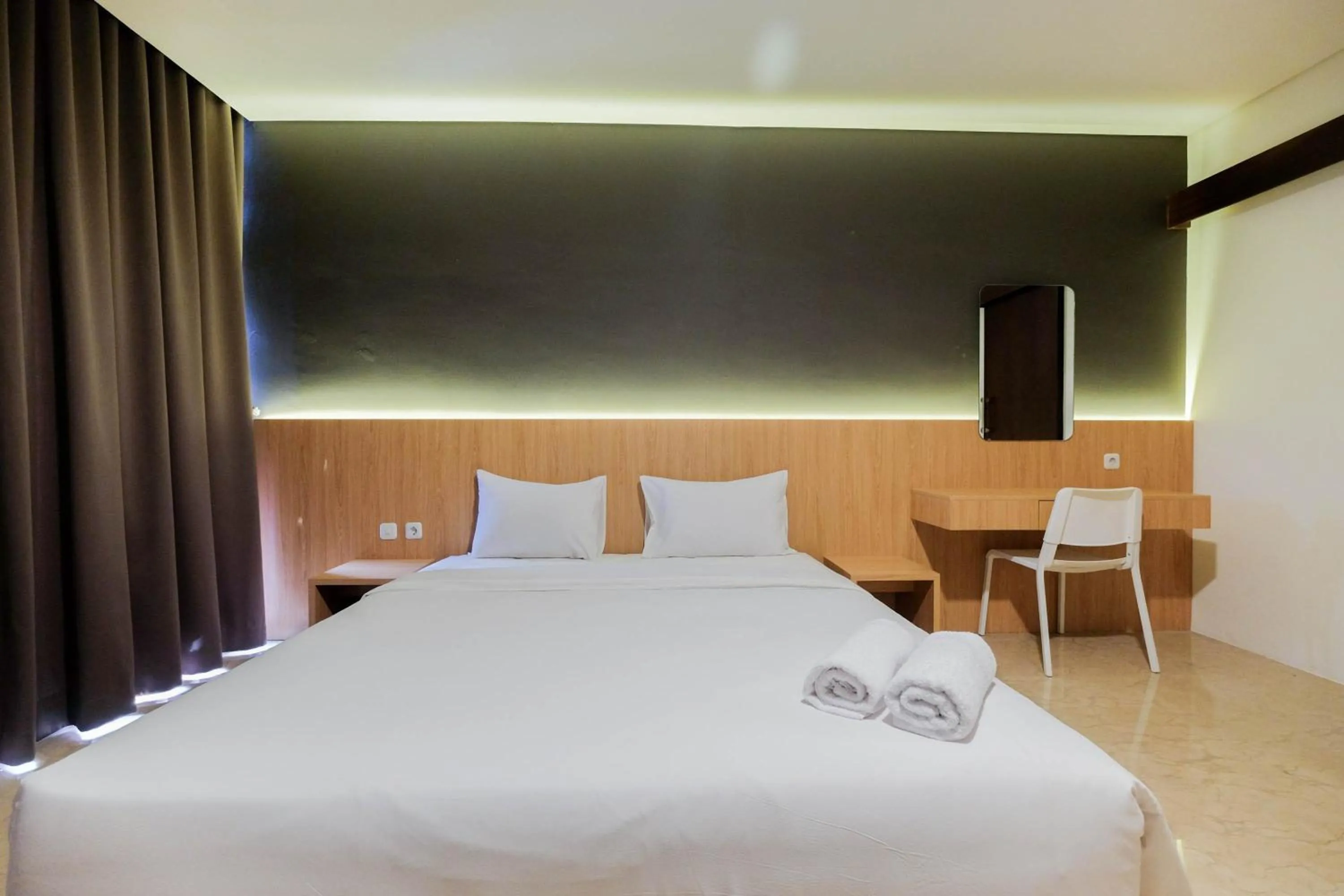 Bed in 1BR Pancoran L'Avenue Comfy Apartment By Travelio