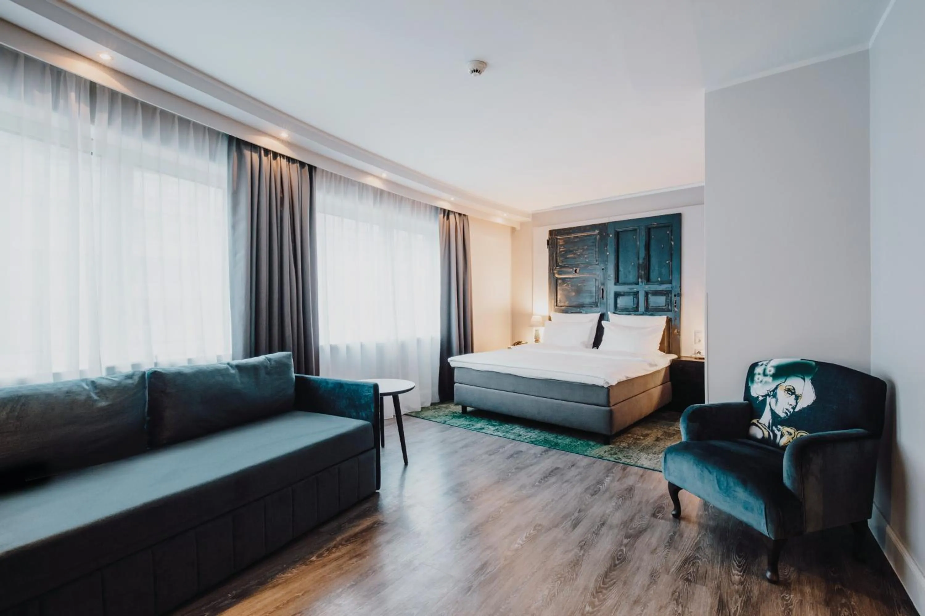 Seating area, Bed in Hotel Berlin, Berlin, a member of Radisson Individuals