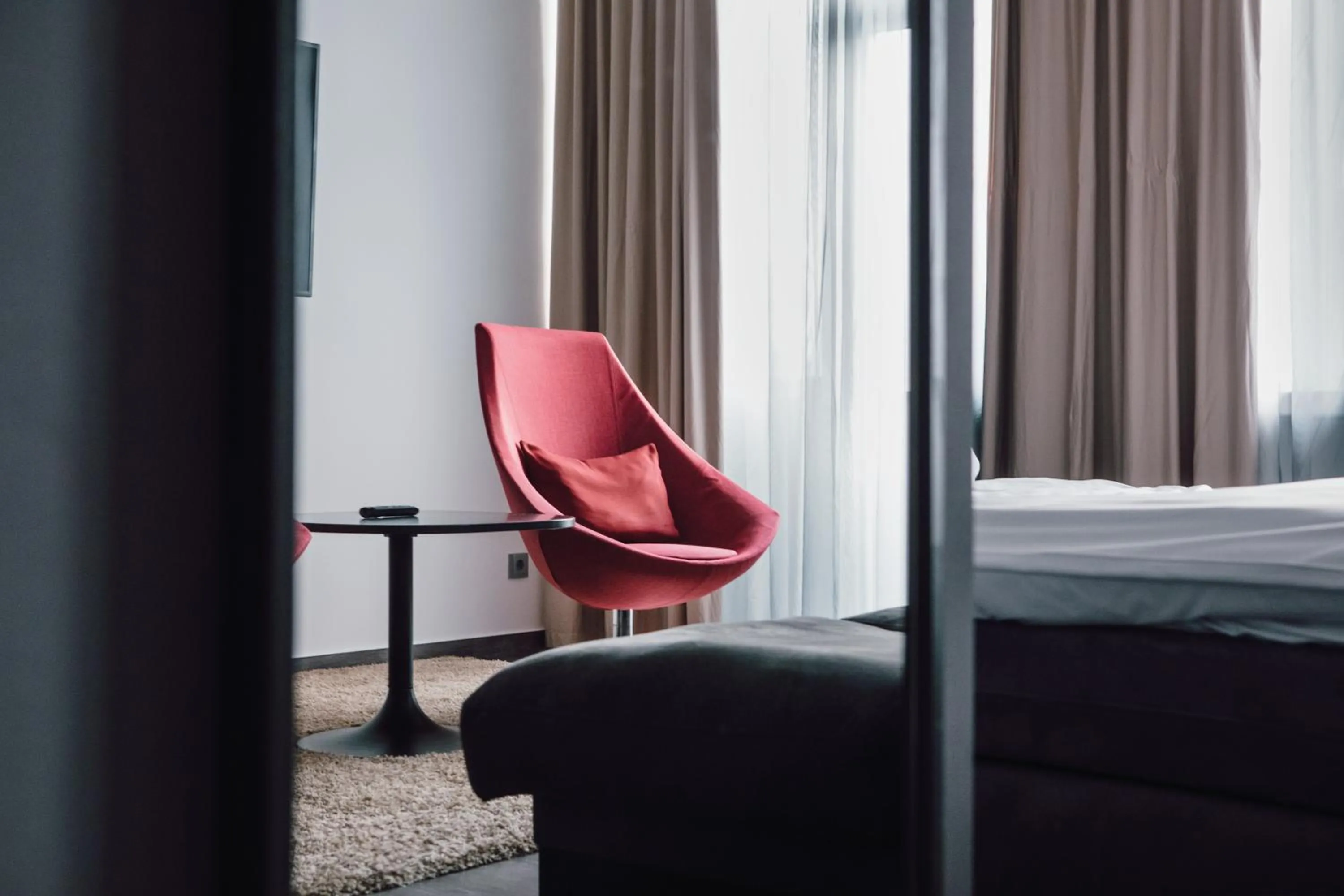 Seating area, Bed in Hotel Berlin, Berlin, a member of Radisson Individuals