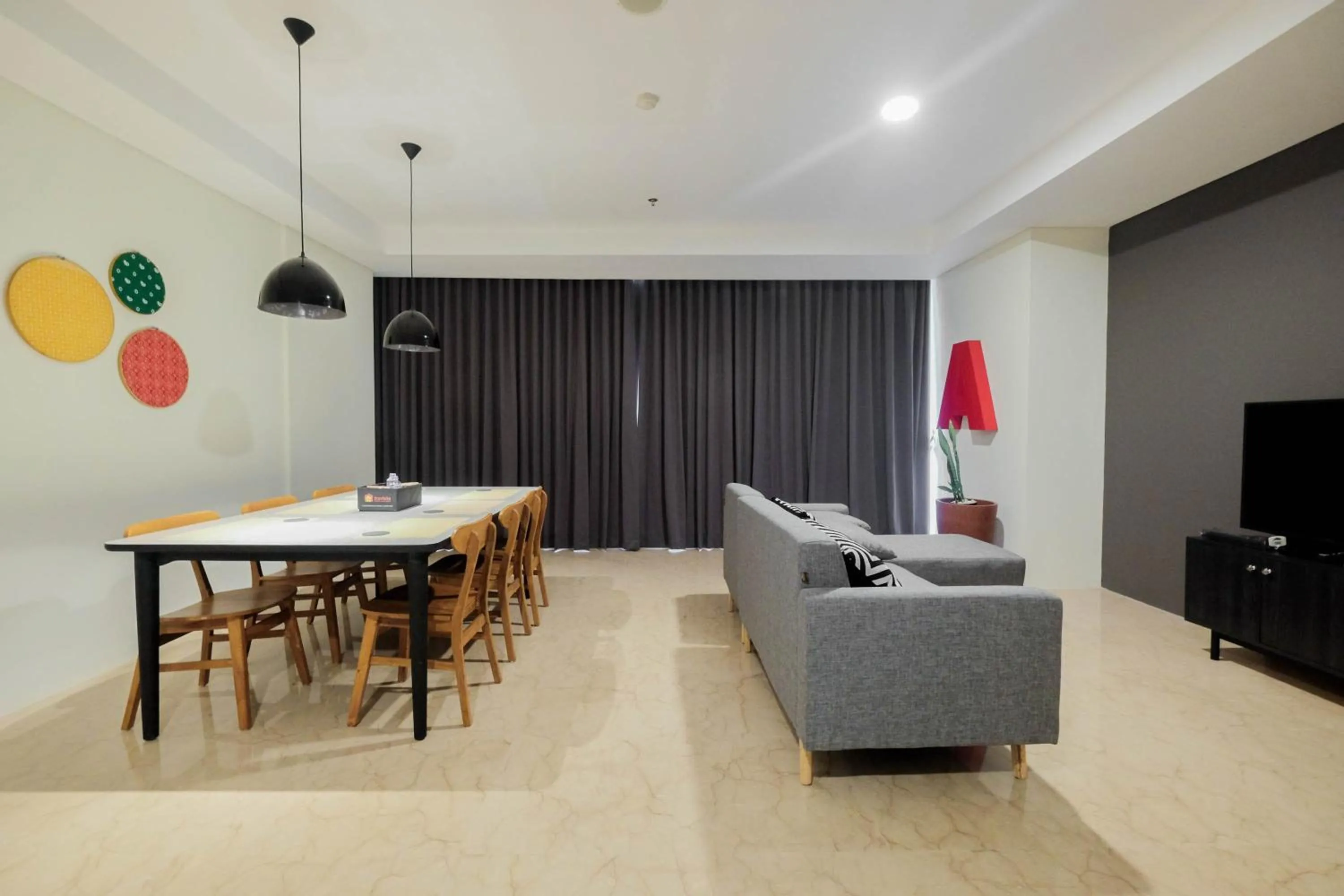 Living room in Comfy 3BR at L'Avenue Apartment Pancoran By Travelio