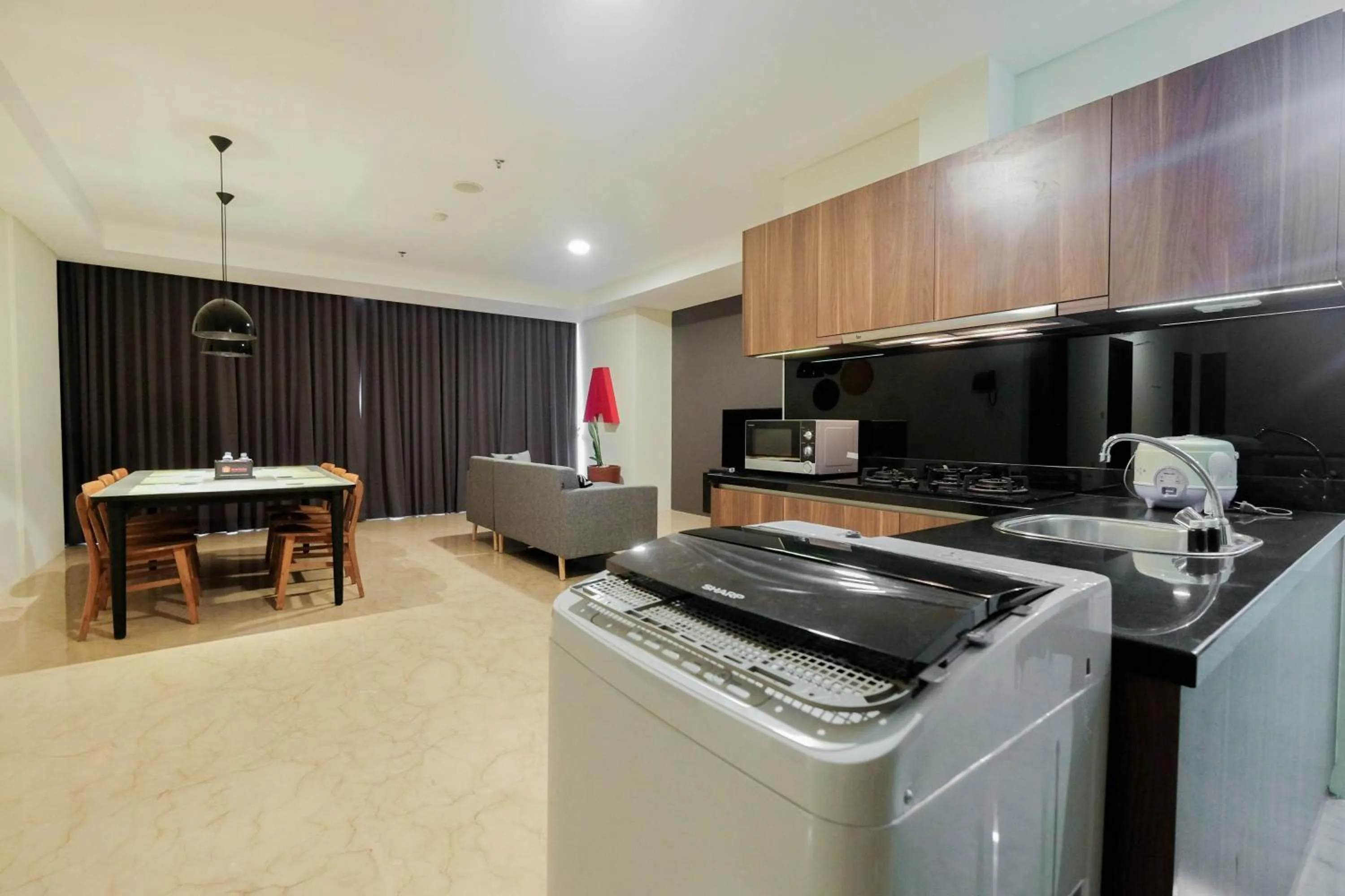 Kitchen or kitchenette in Comfy 3BR at L'Avenue Apartment Pancoran By Travelio