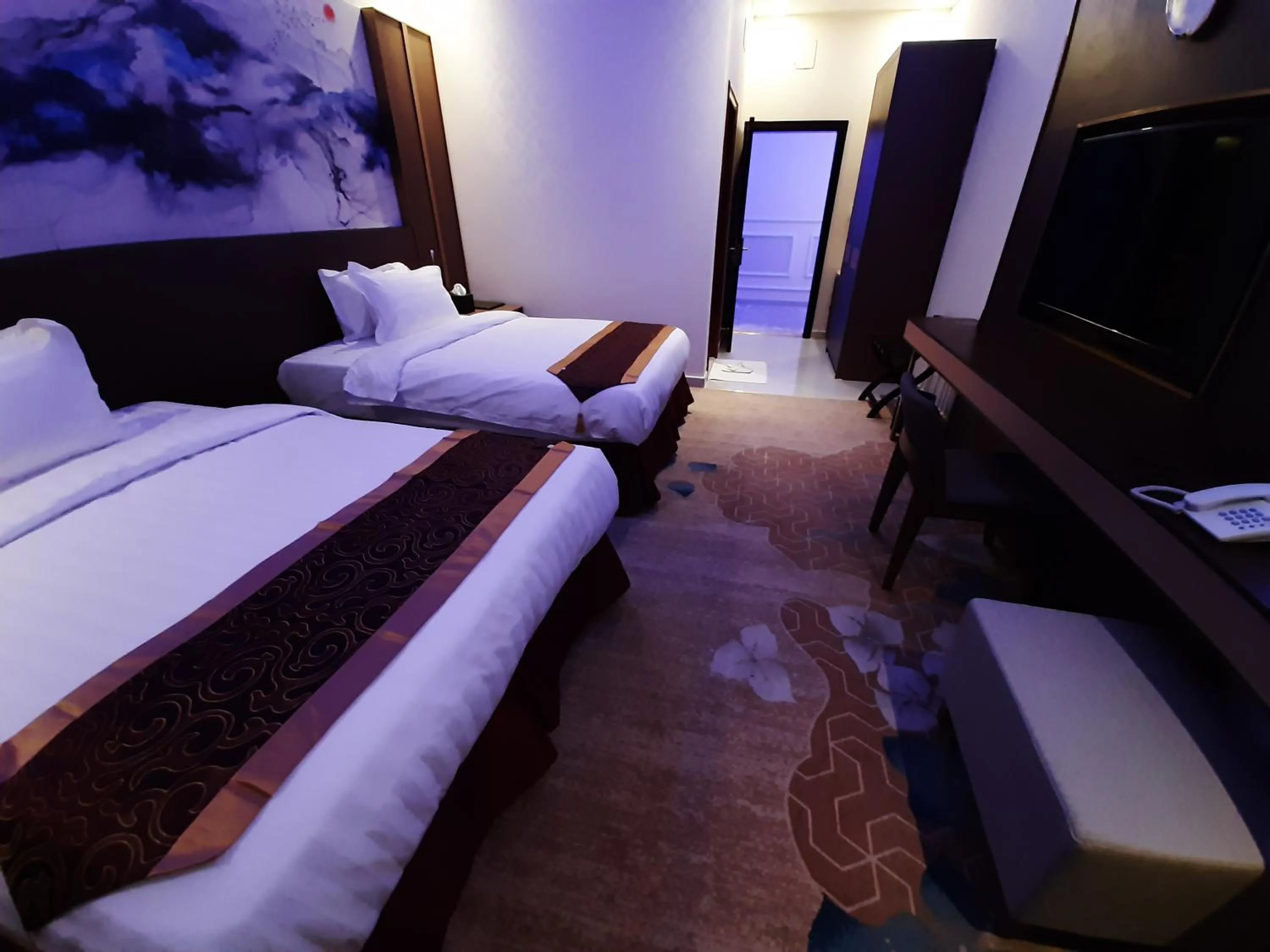 Bed in Qasr Alshamal Hotel