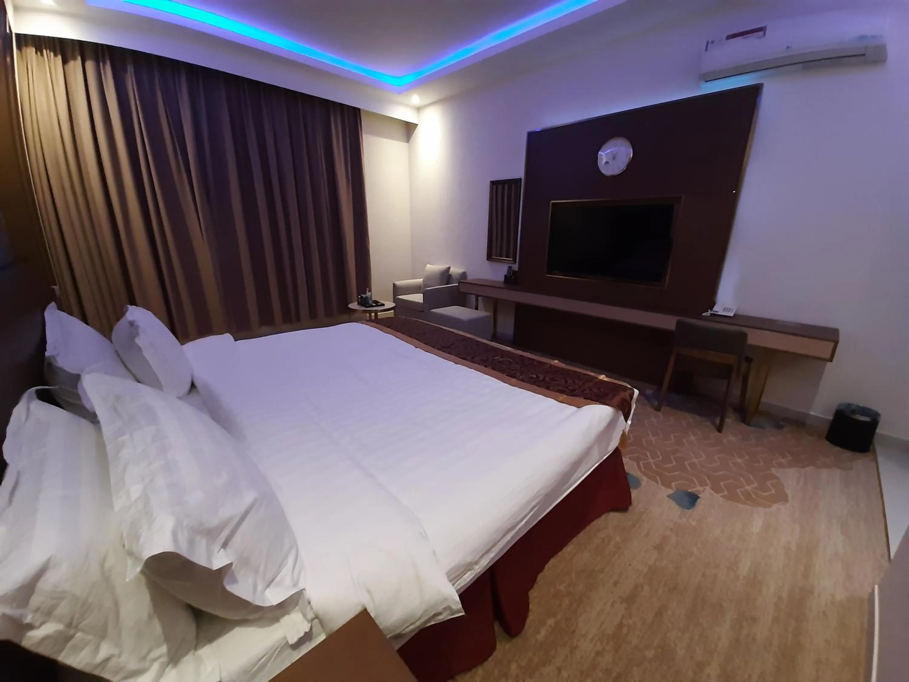 Bed in Qasr Alshamal Hotel