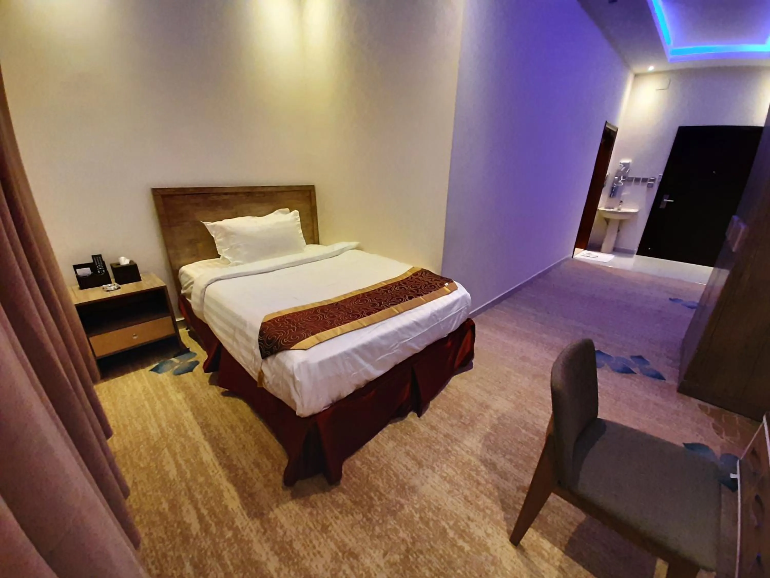 Bed in Qasr Alshamal Hotel