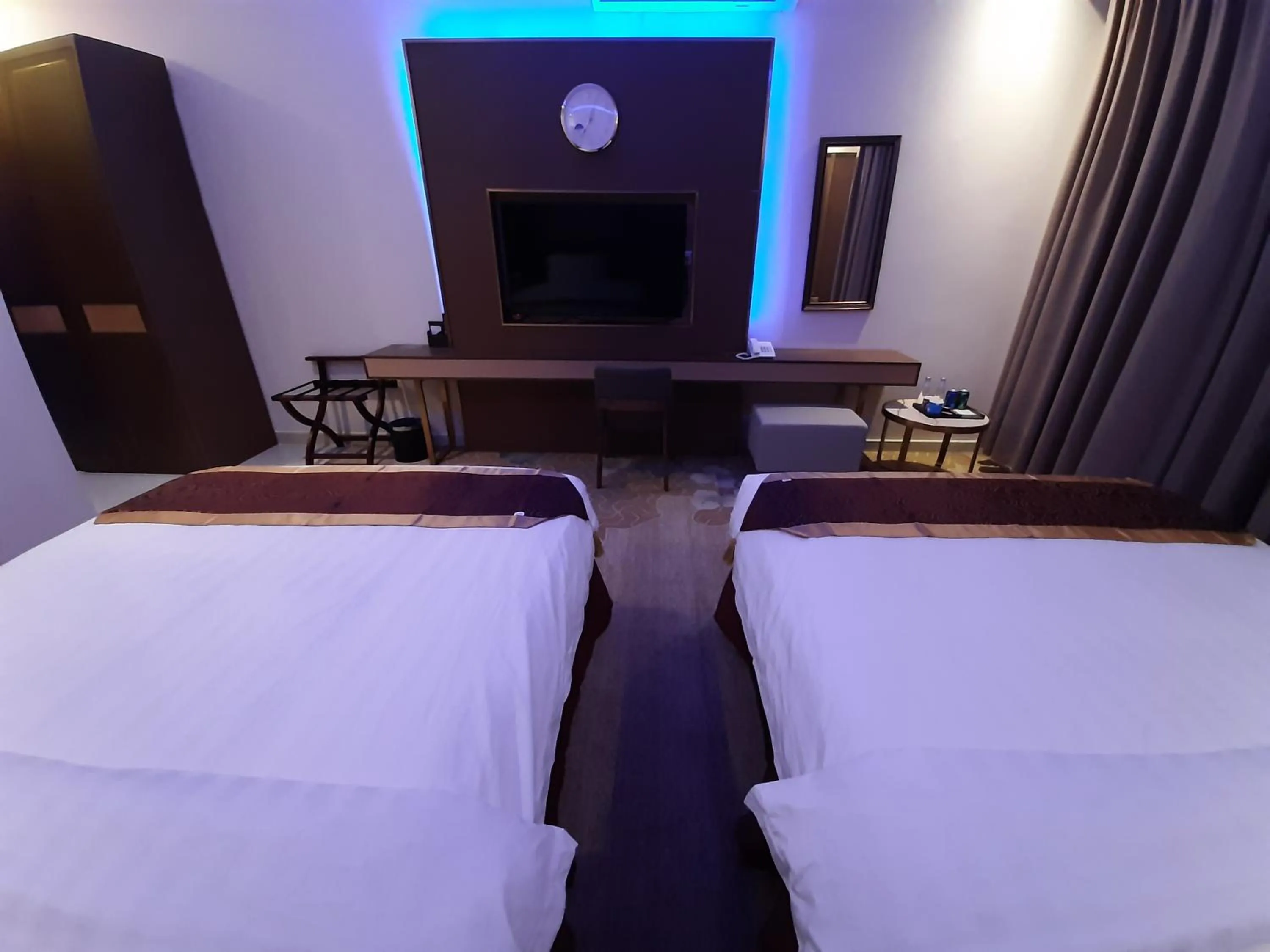 Bed in Qasr Alshamal Hotel