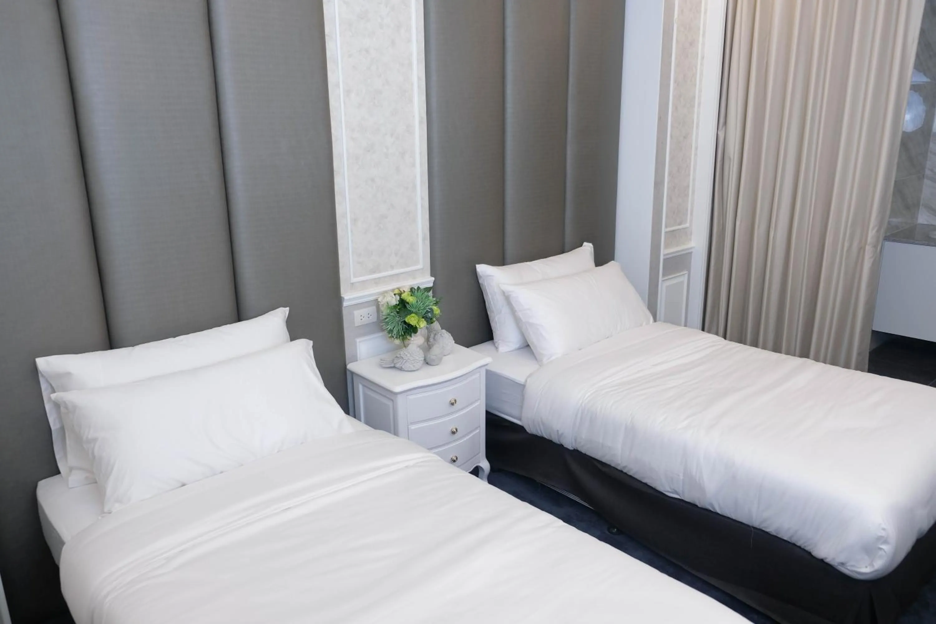 Bed in VARIMANTRA HOTEL