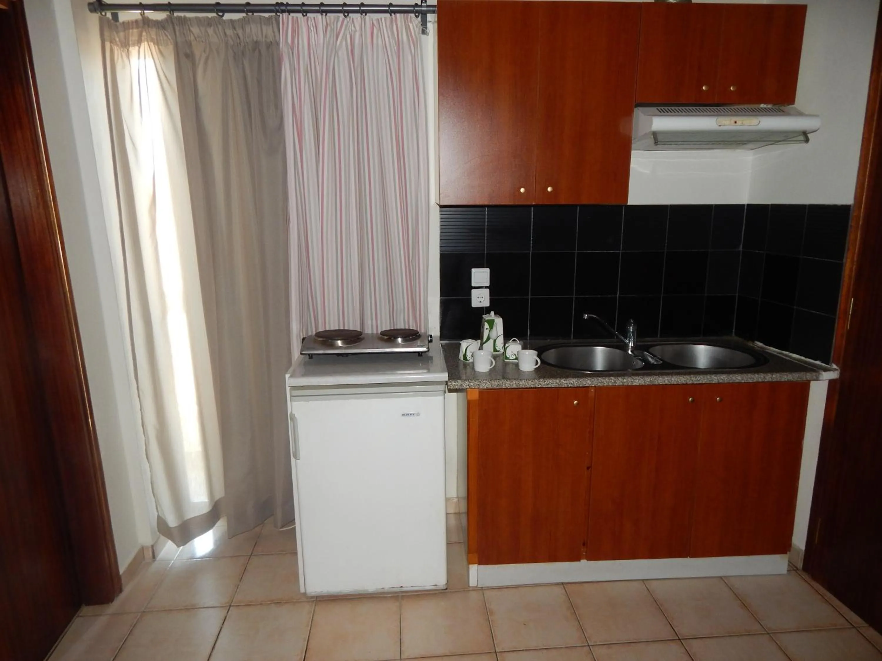 Kitchen or kitchenette in Posidonio Hotel