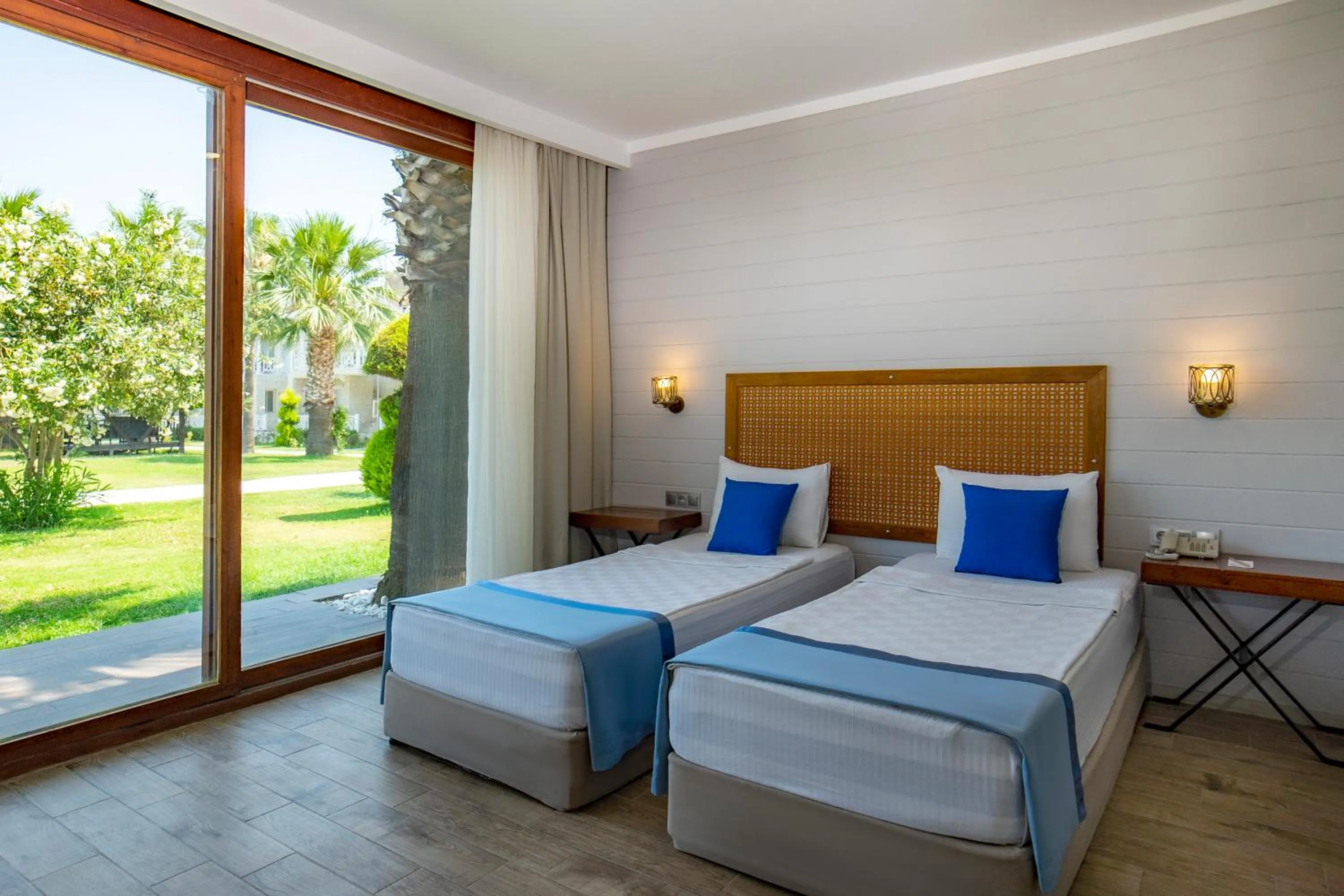 Bed in Risus Beach Resort Hotel